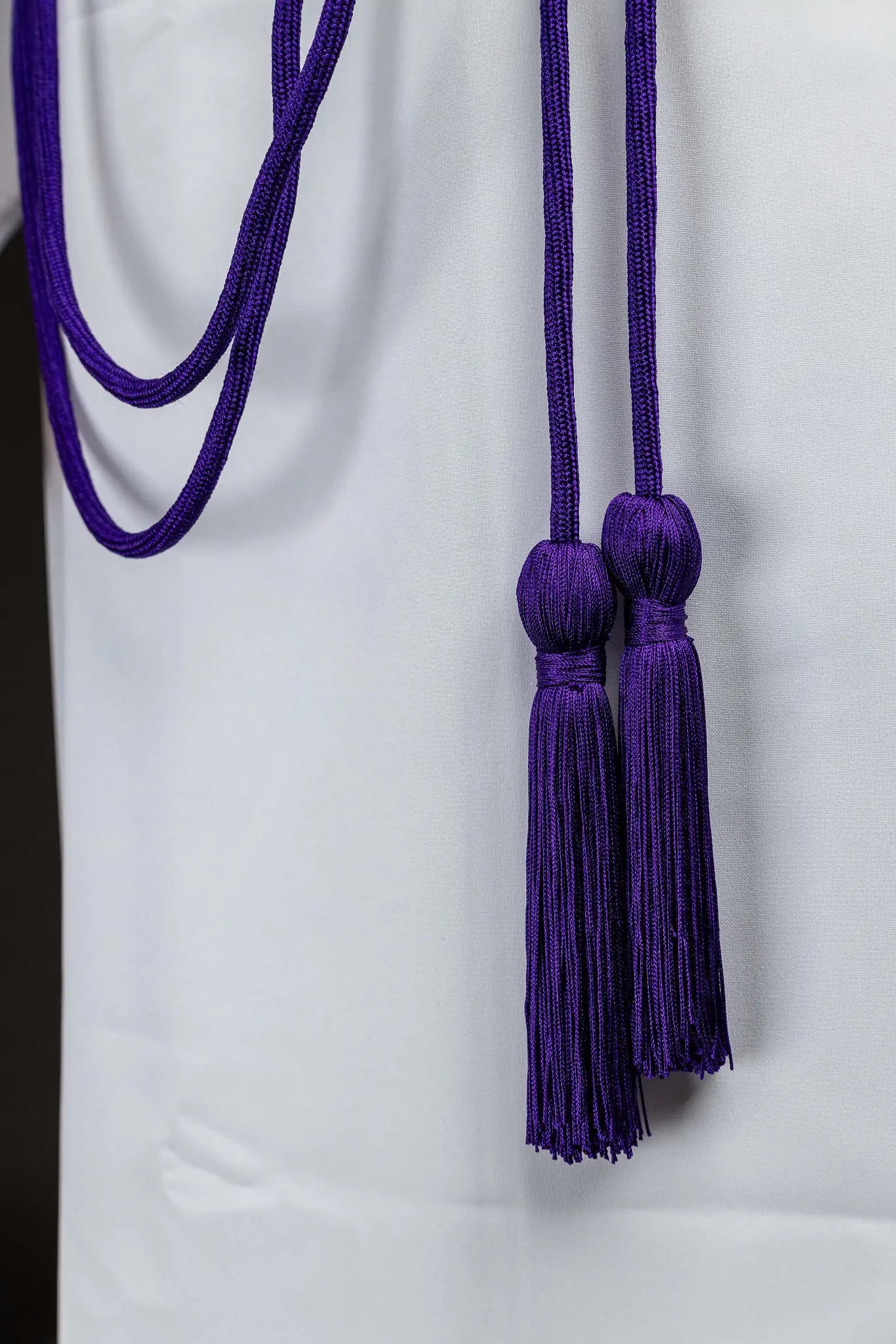 Purple braided liturgical cincture with long tassels