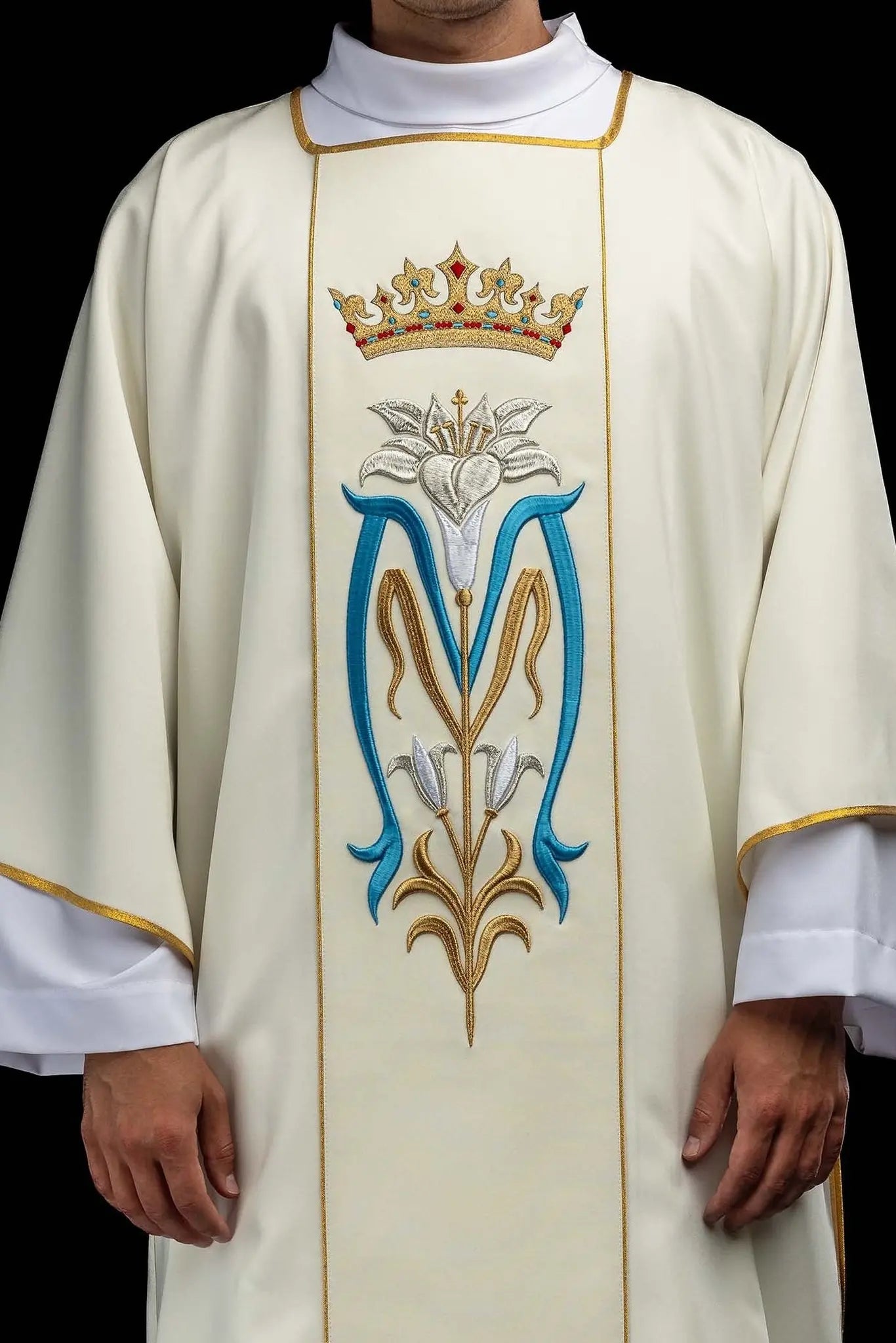 Ecru dalmatic with Marian embroidery, gold trim, and a matching stole.