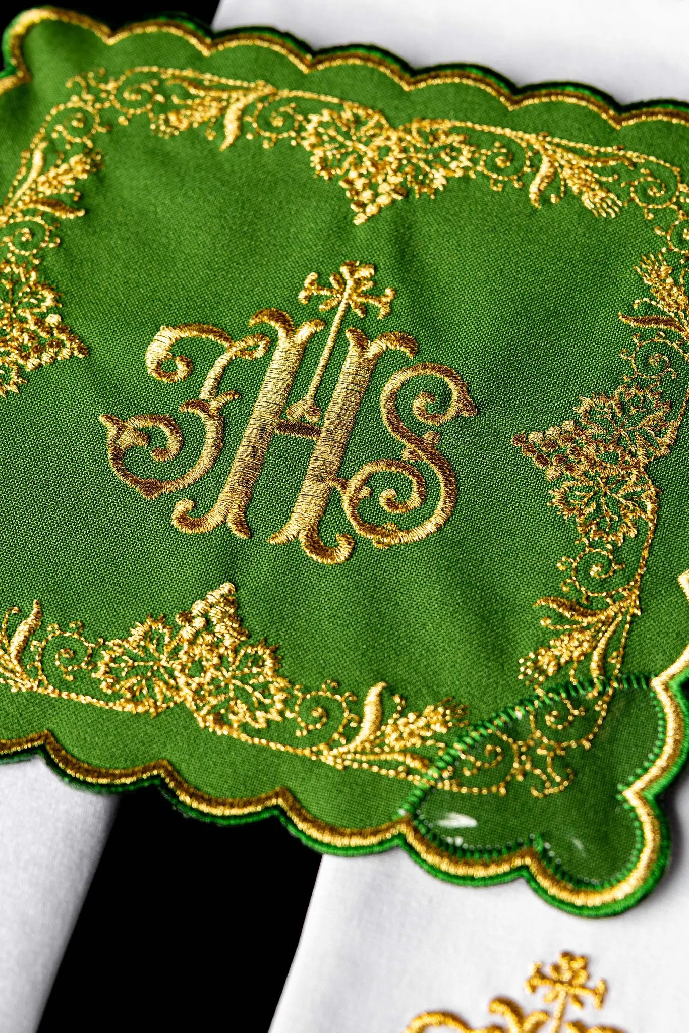 Green chalice linen set with IHS monogram, cross, acanthus leaves, and grapevines embroidered in gold. Includes pall, corporal, purificator, and lavabo towel.