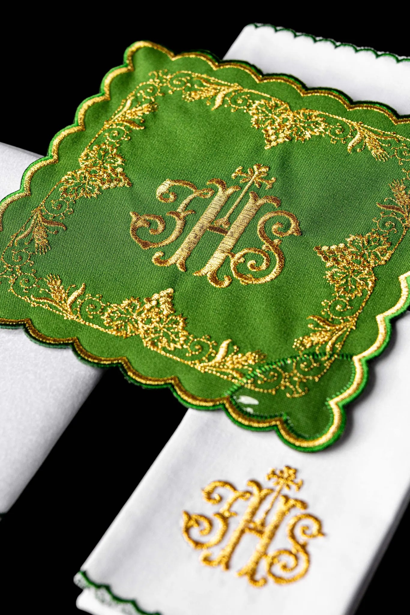 Green chalice linen set with IHS monogram, cross, acanthus leaves, and grapevines embroidered in gold. Includes pall, corporal, purificator, and lavabo towel.