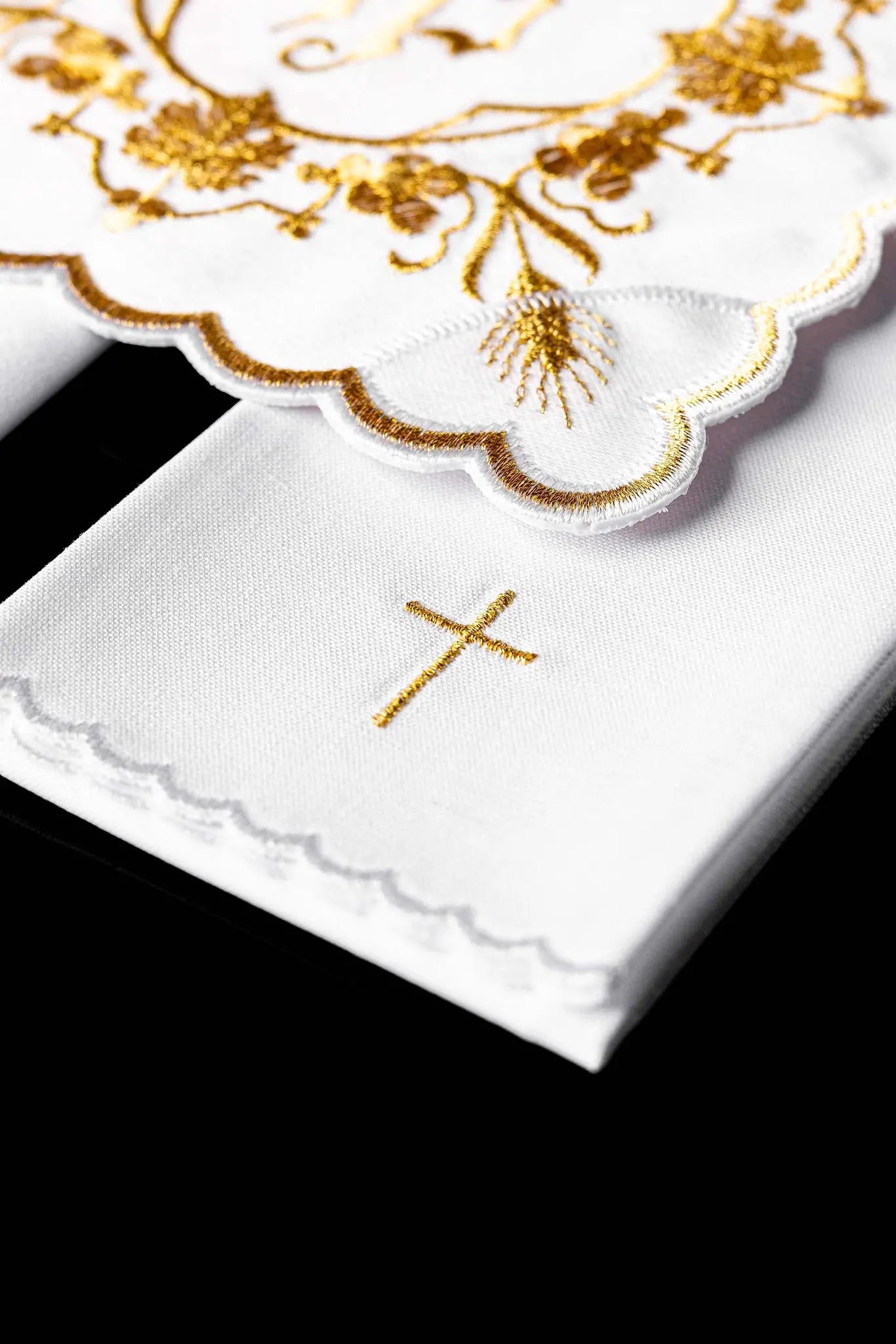 White chalice linen set with IHS embroidery on pall, purificator, and lavabo towel.