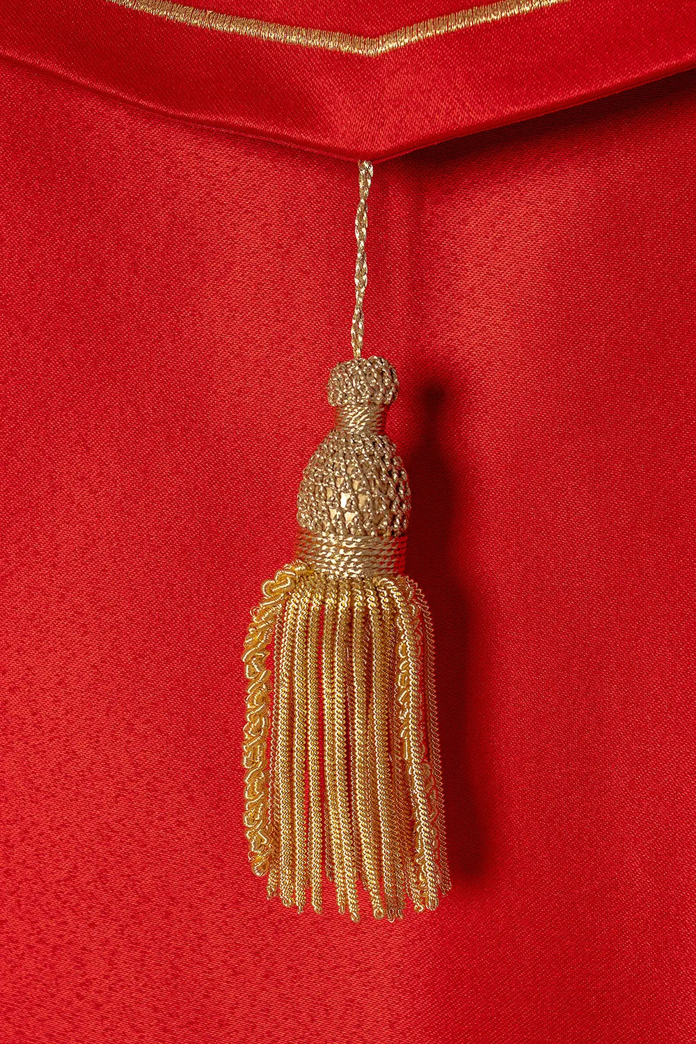 Red liturgical cape with gold monogram