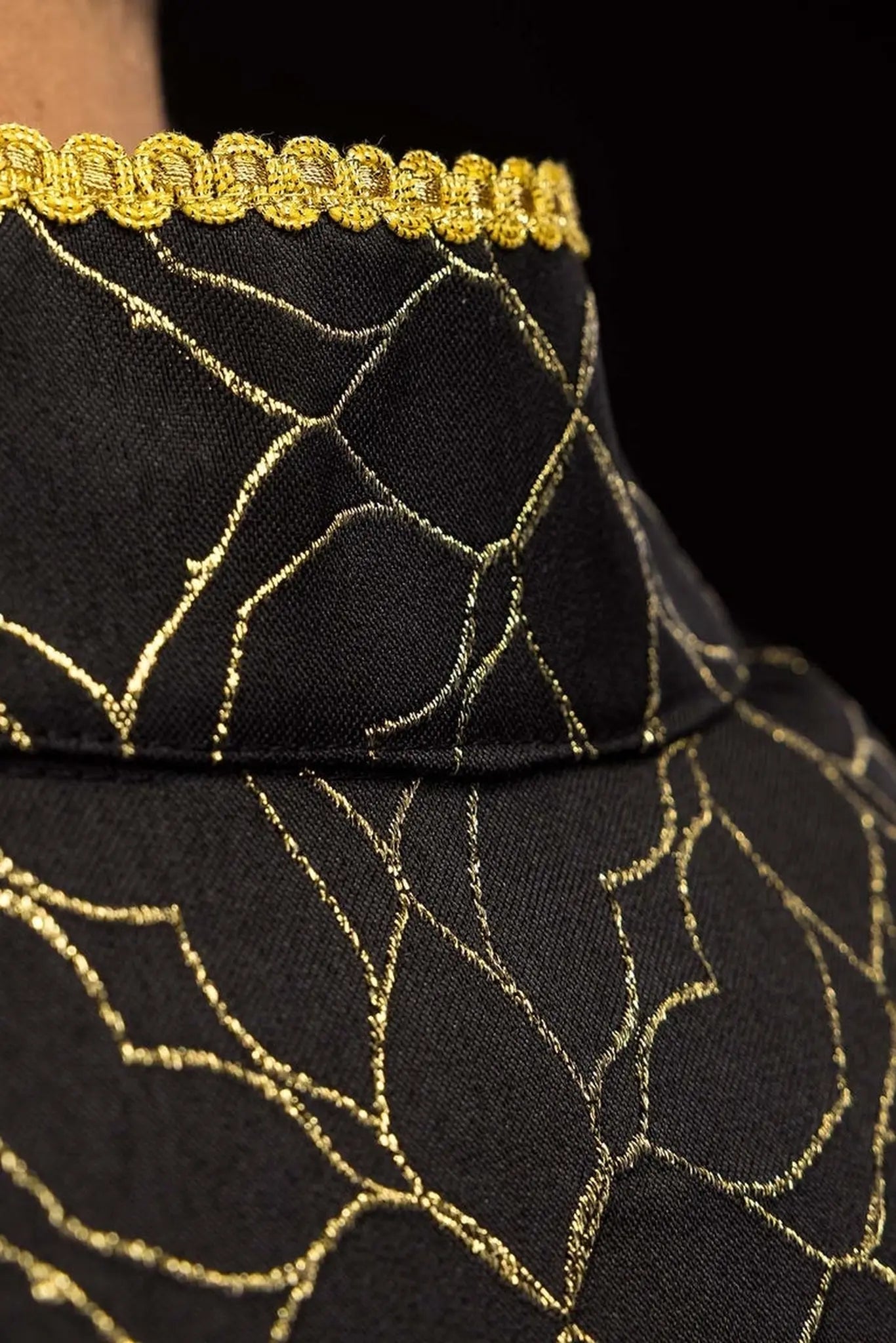 Embroidered black cope decorated with jacquard fabric