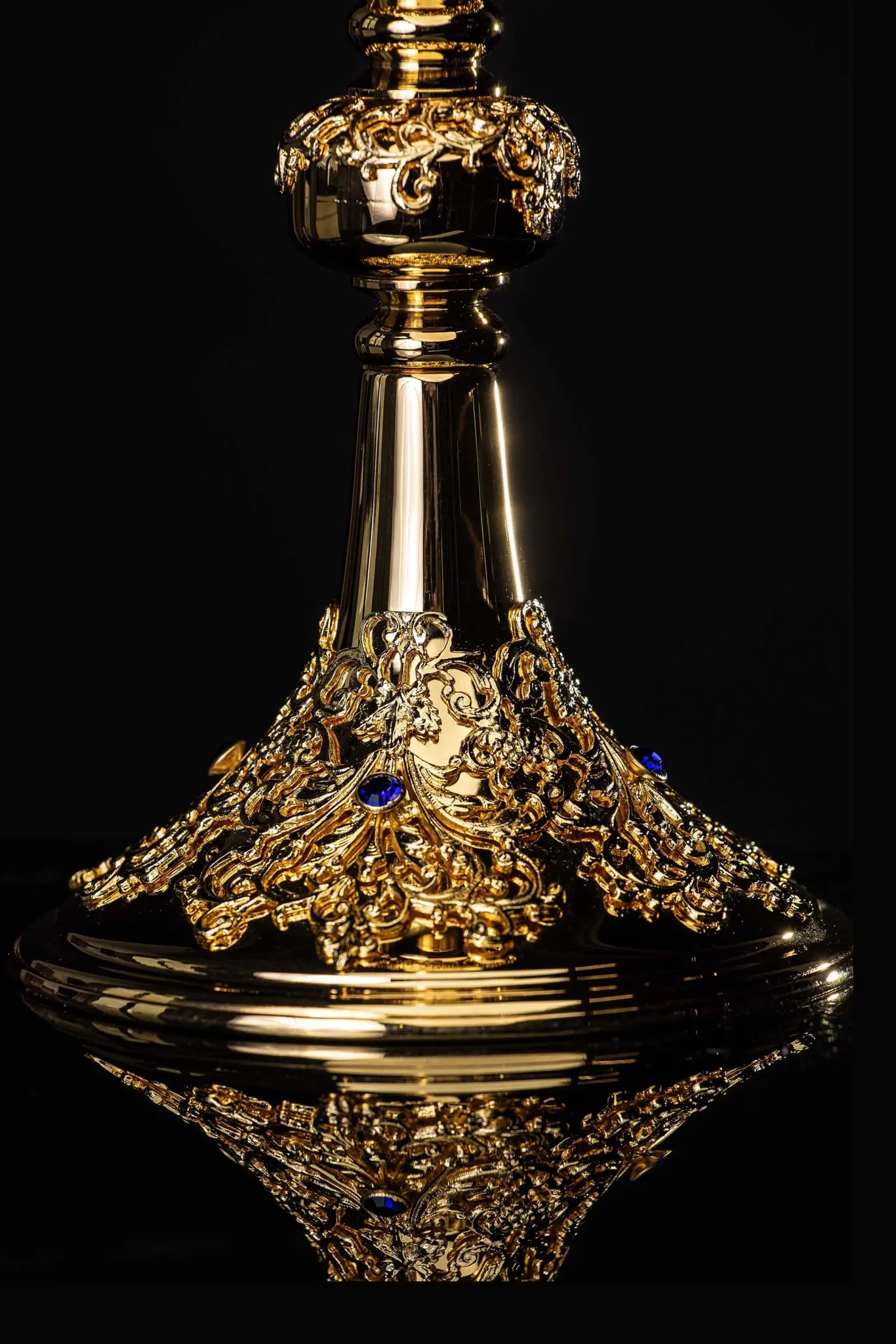 Handmade gold-plated chalice with floral ornamentation on the cup, knop, and base, adorned with blue imitation sapphires.