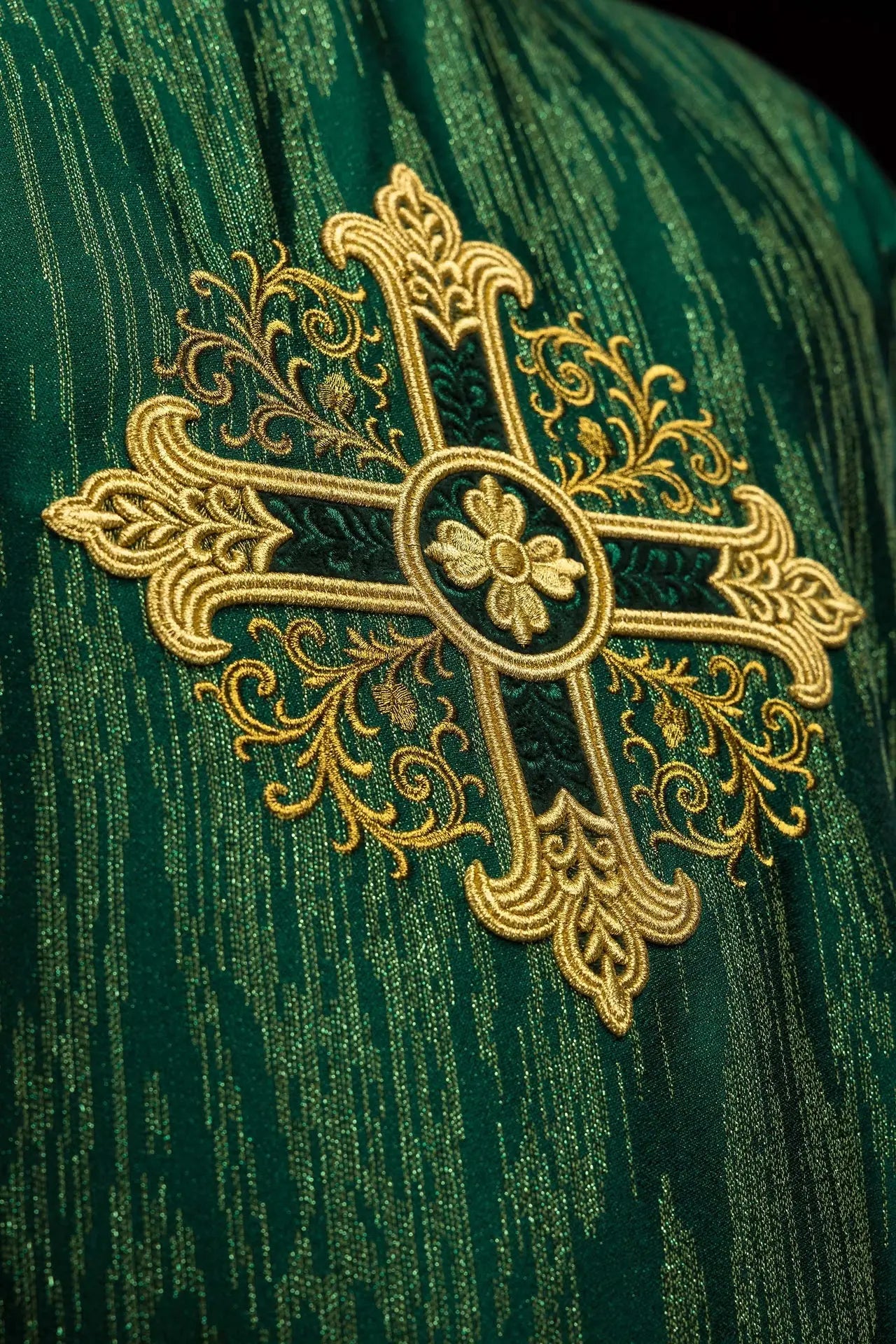 Green chasuble with an embroidered cross motif on decorative fabric