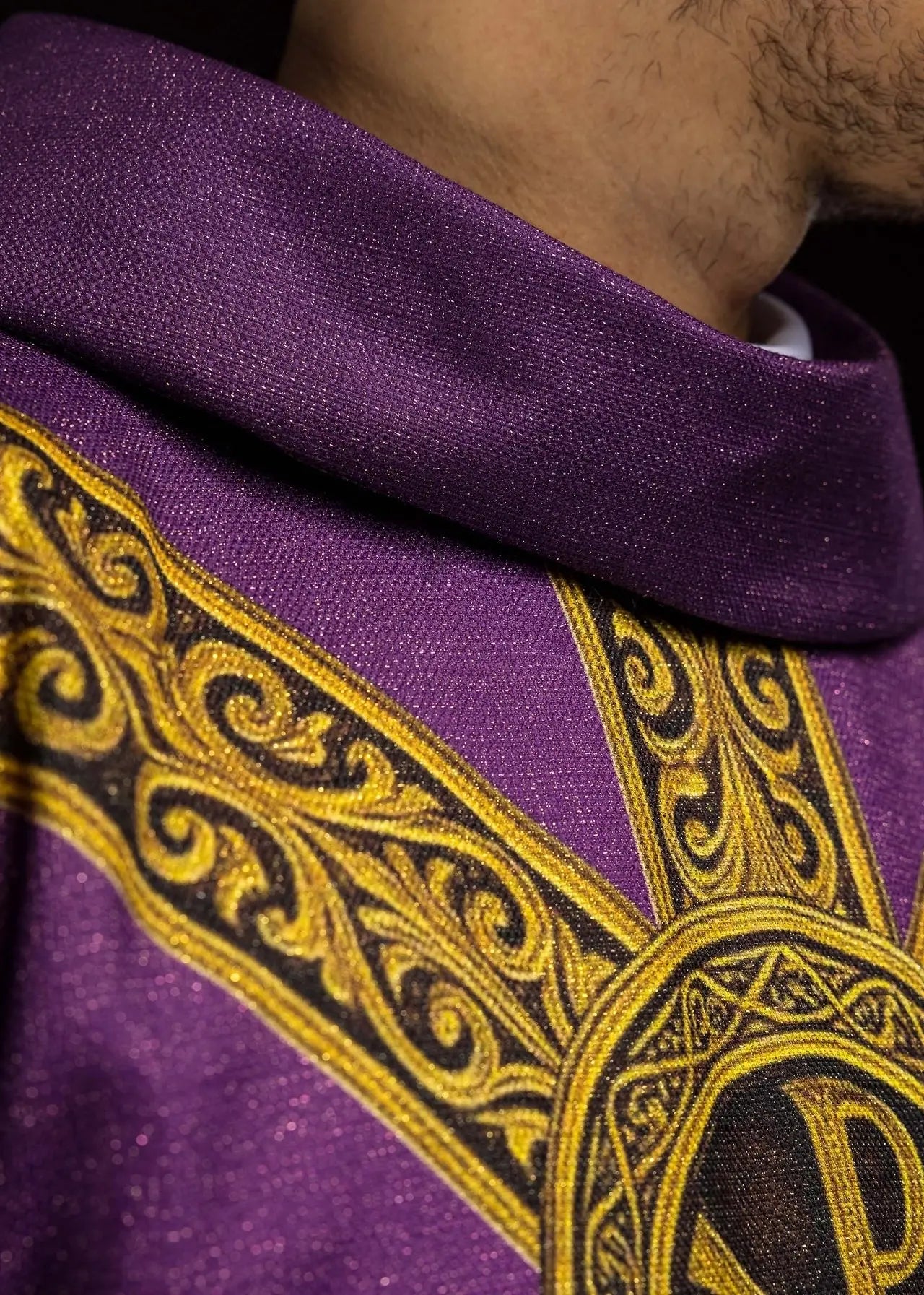 Purple printed “Pax” chasuble with rich gold decoration