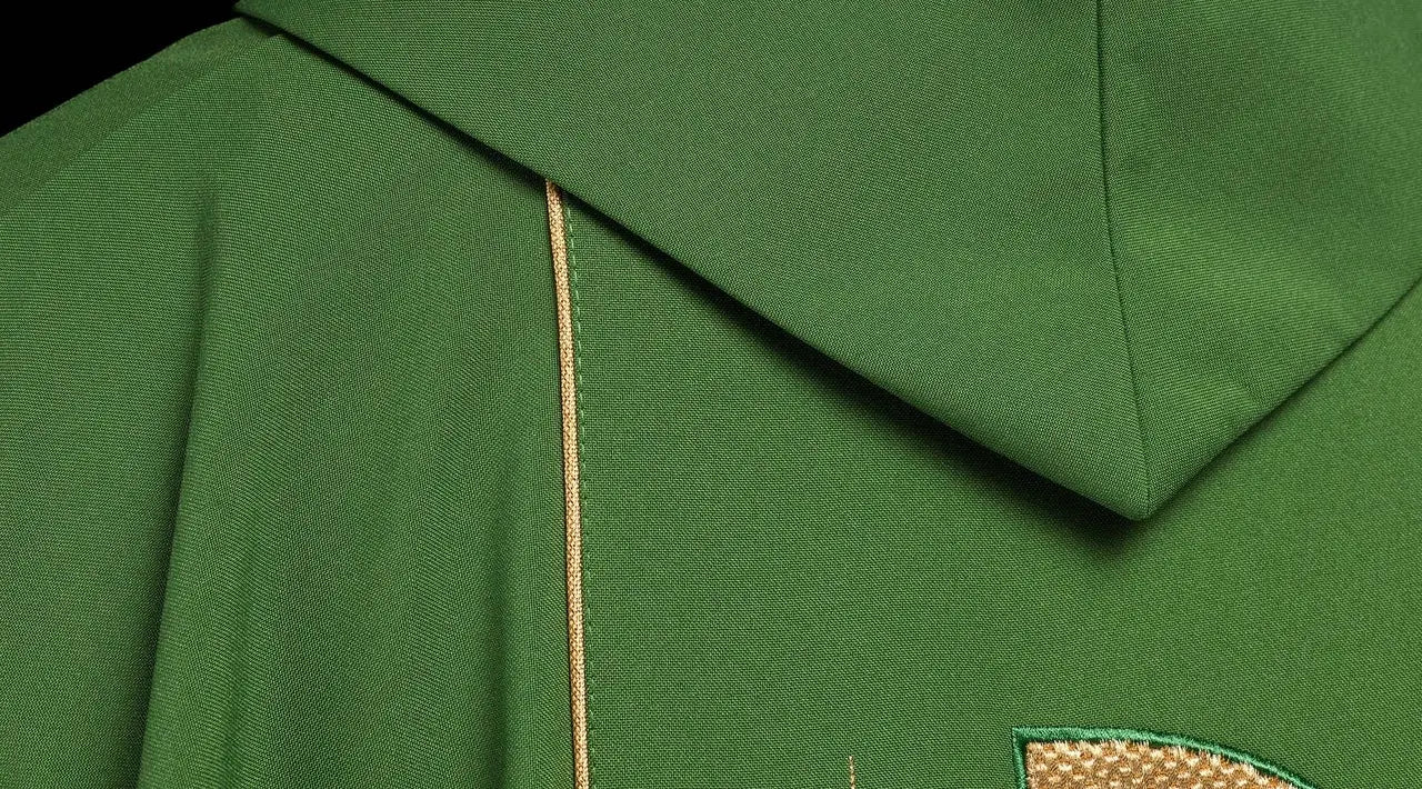 Green chasuble embroidered with IHS chalice design