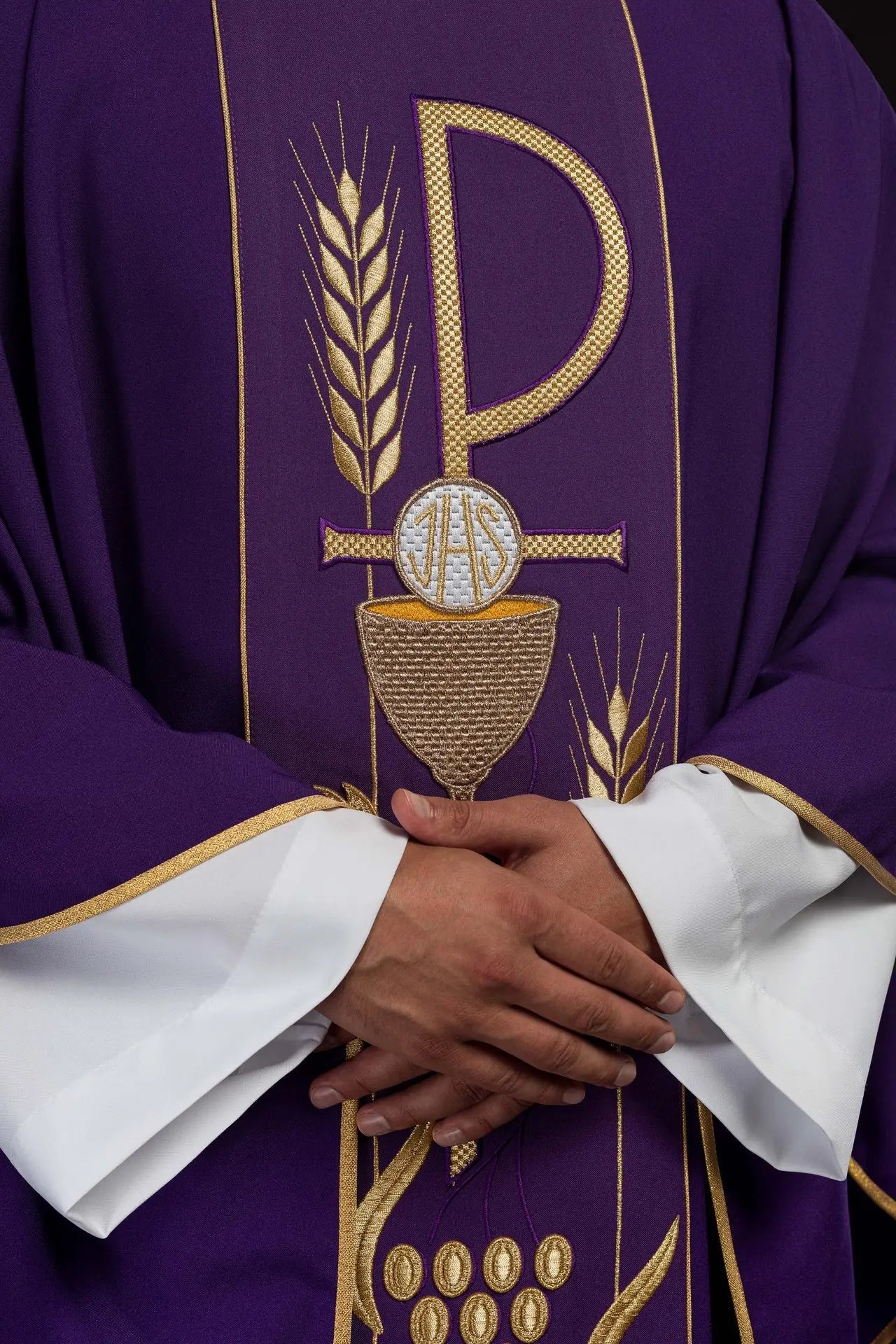 Purple chasuble embroidered with IHS chalice pattern