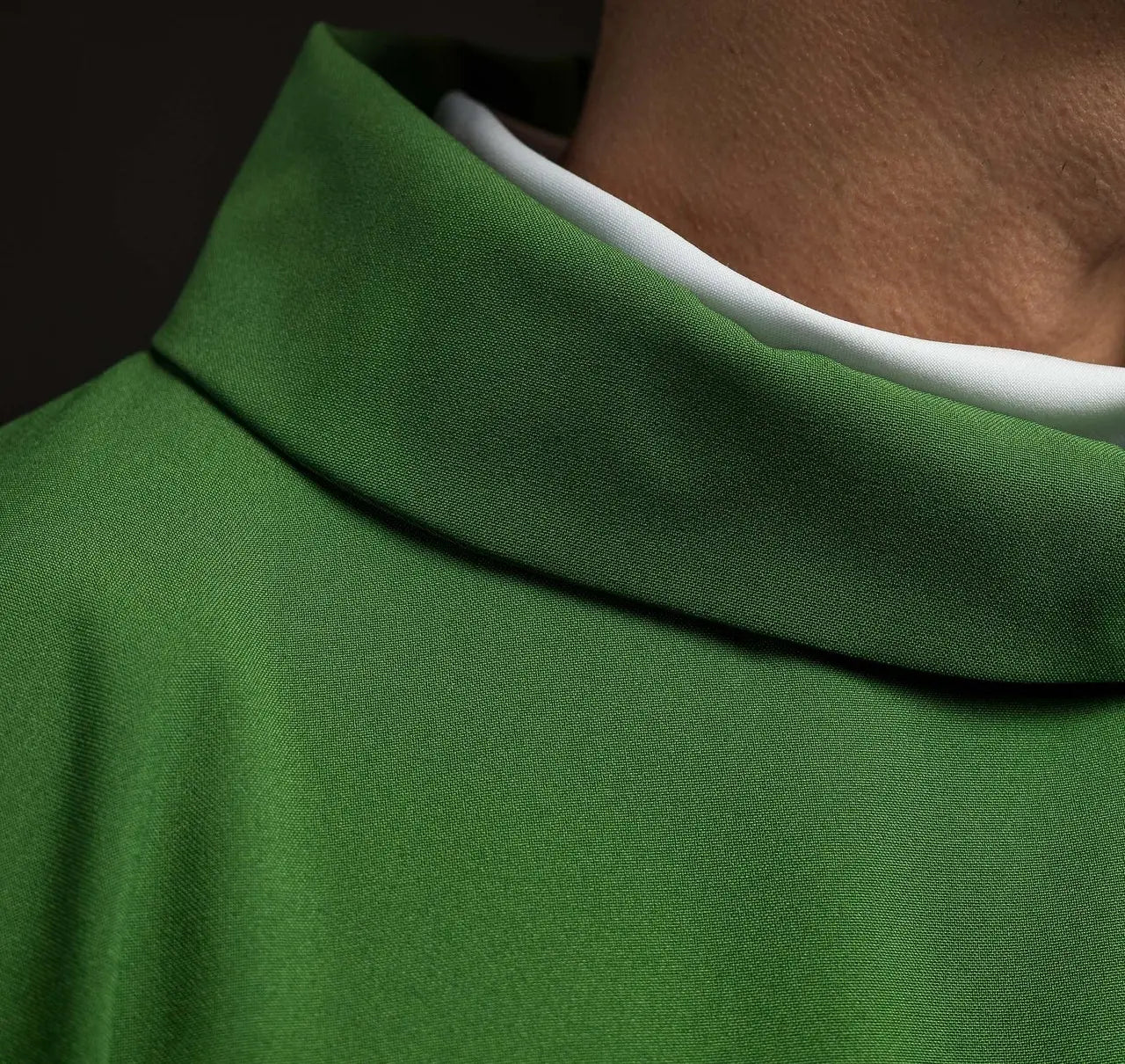 Green chasuble embroidered with IHS motif