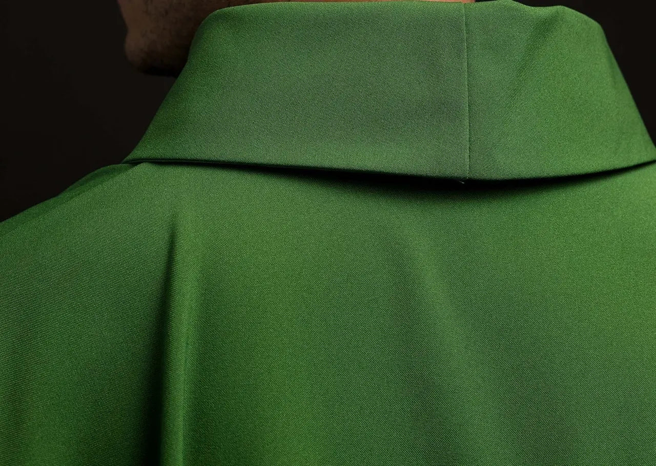 Green chasuble embroidered with IHS motif