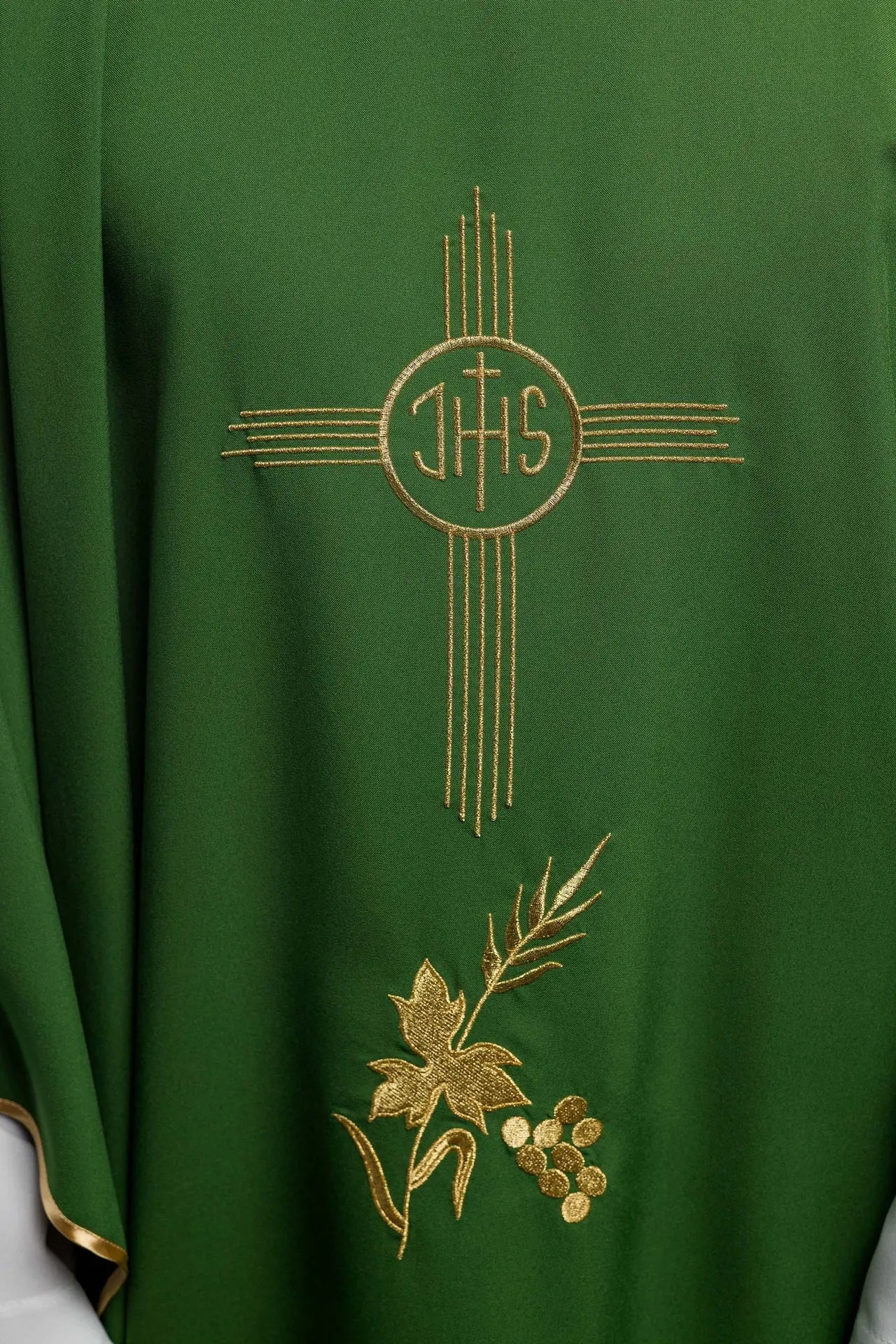 Green chasuble embroidered with IHS motif