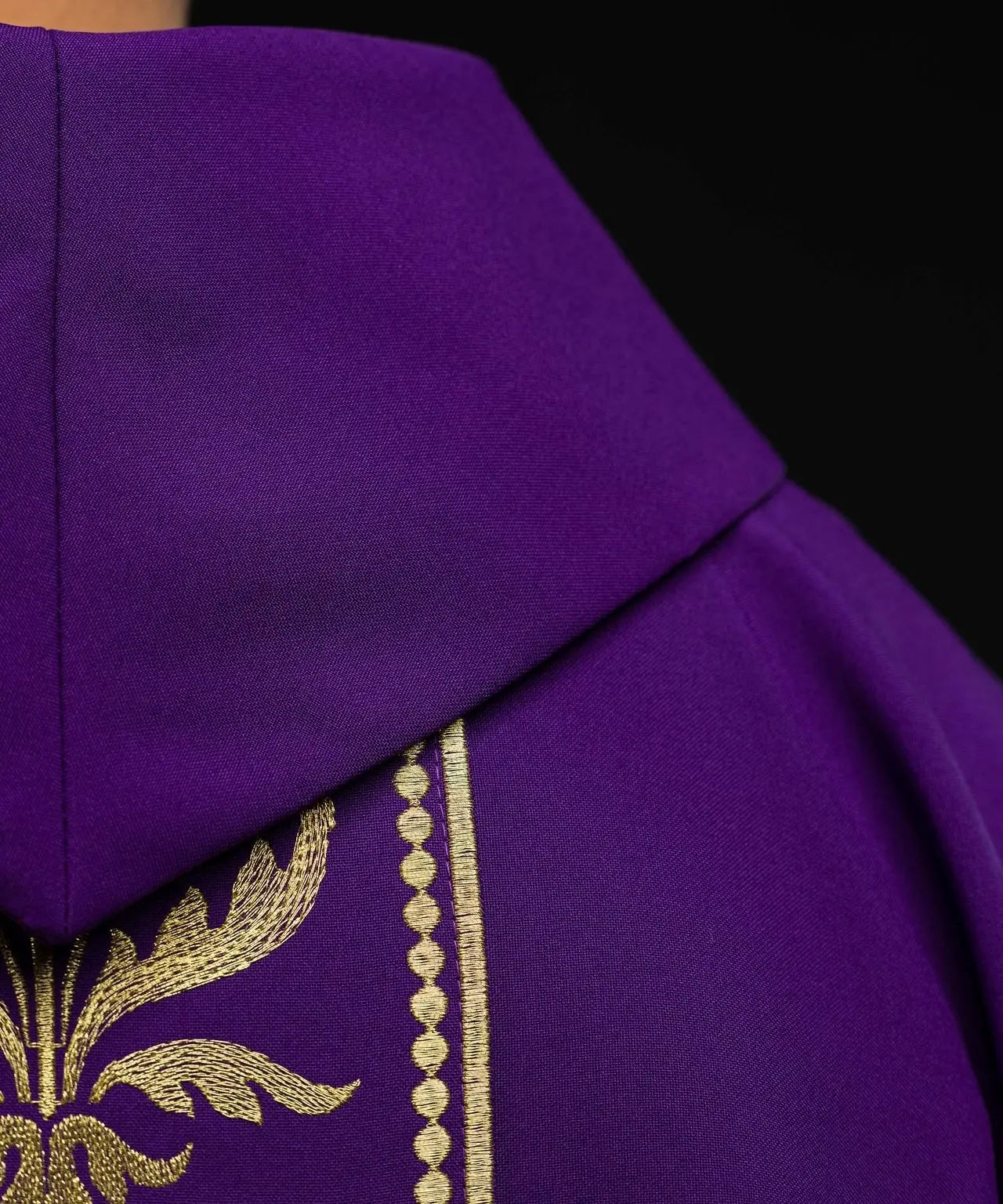 Purple liturgical chasuble decorated with gold embroidered belt