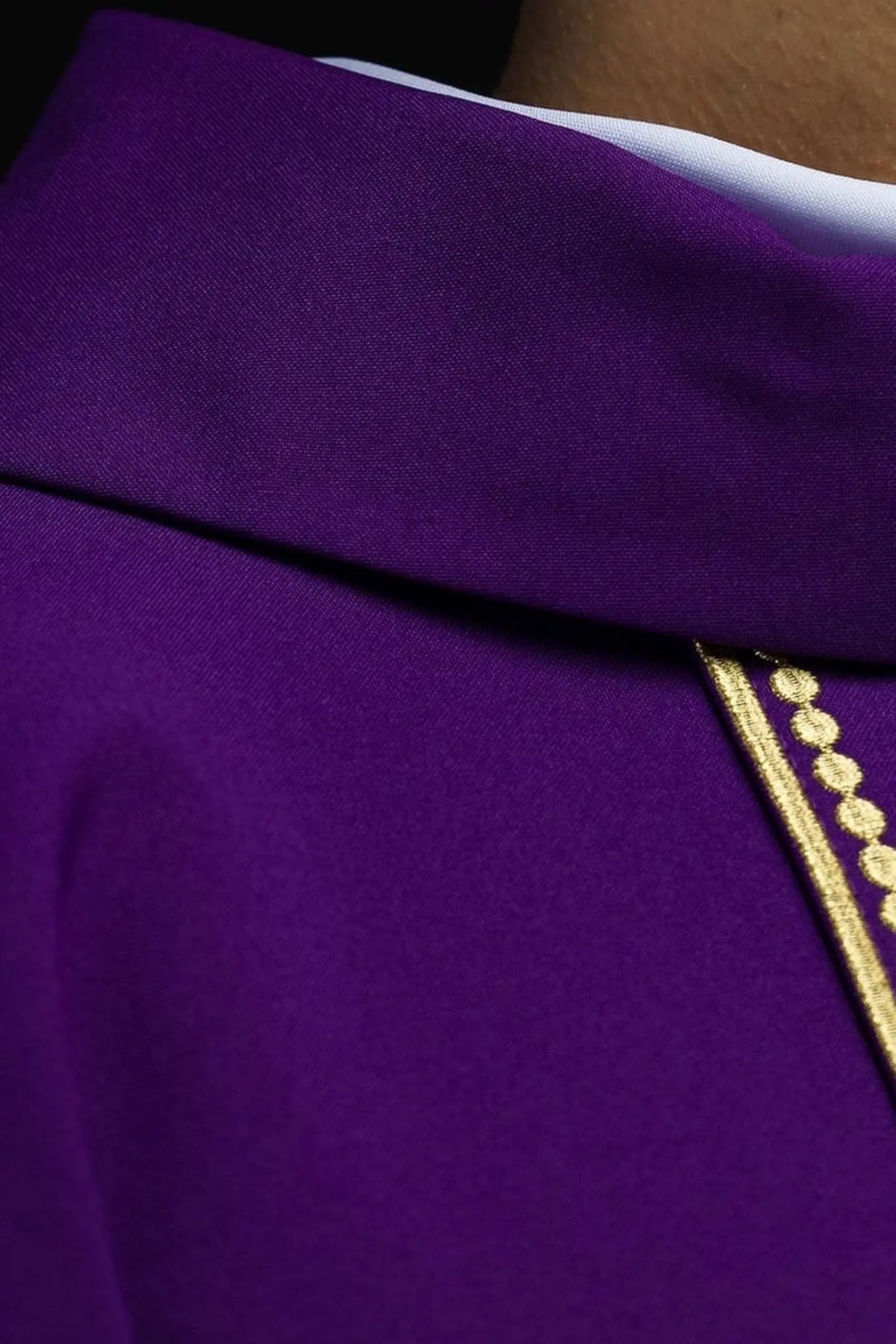 Purple liturgical chasuble decorated with gold embroidered belt