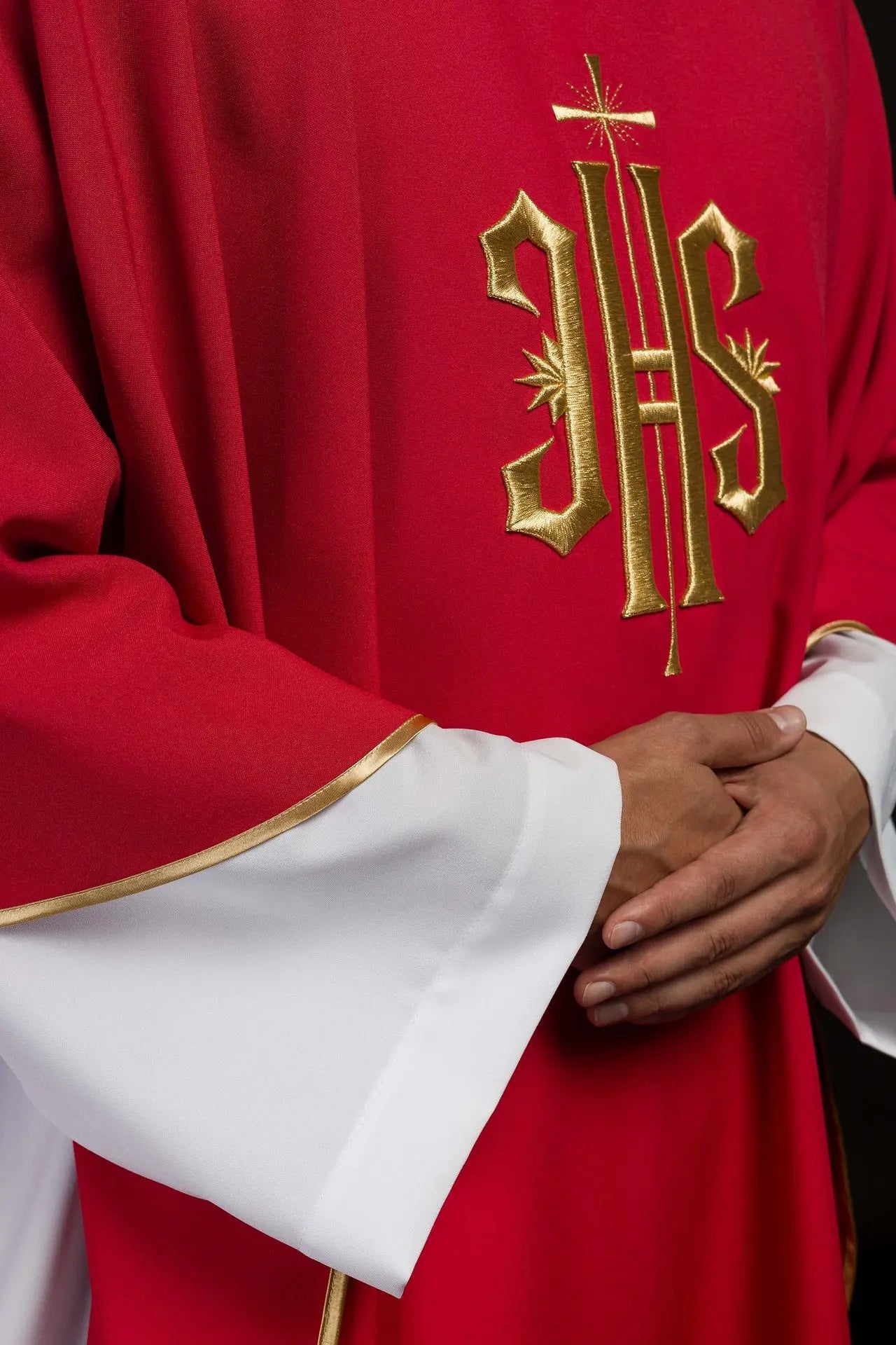 Red chasuble embroidered with gold IHS motif