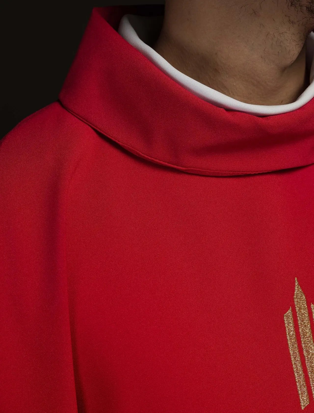 Red chasuble embroidered with IHS Cross