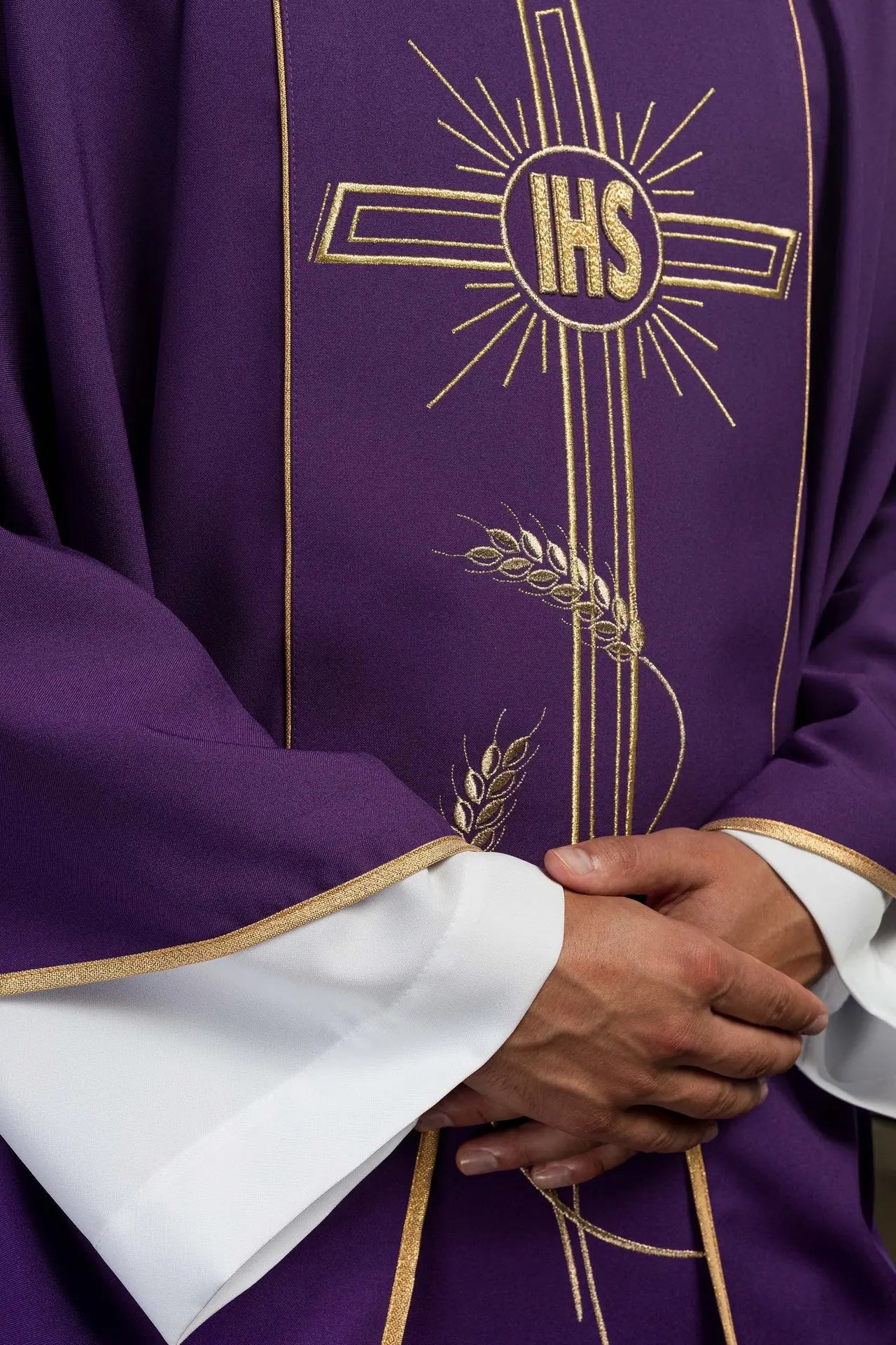 Purple chasuble with wide gold embroidered stripe IHS cross