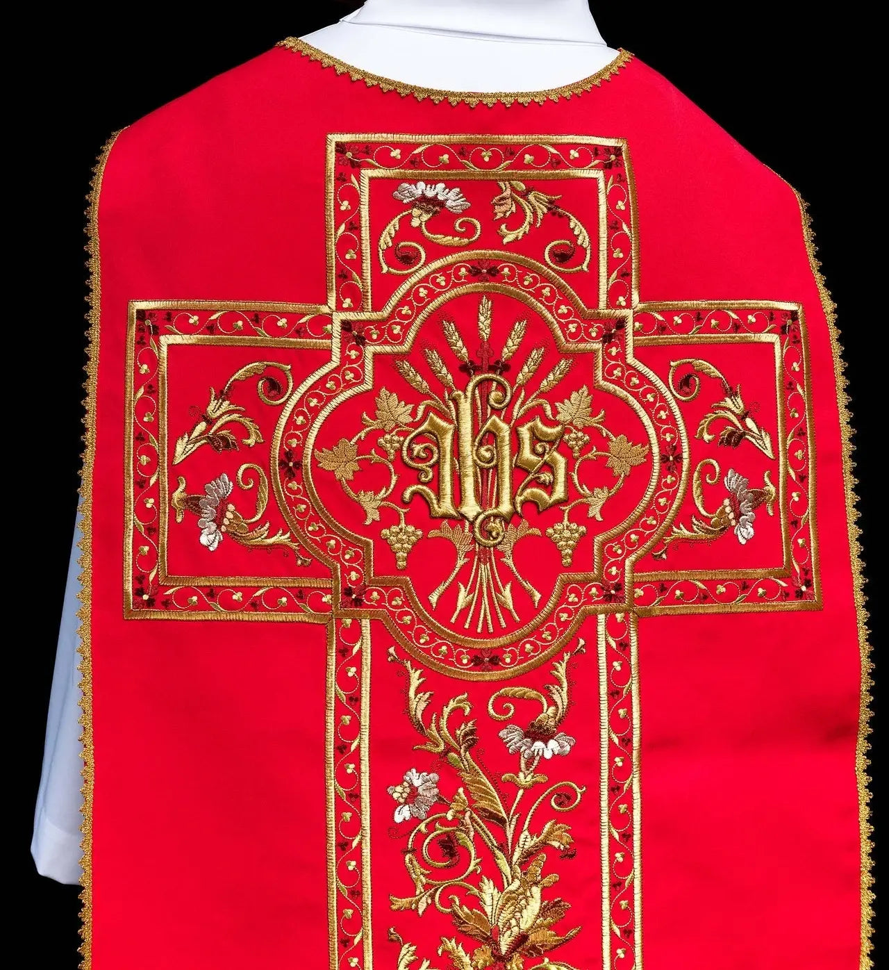 Red Roman chasuble embroidered with IHS motif