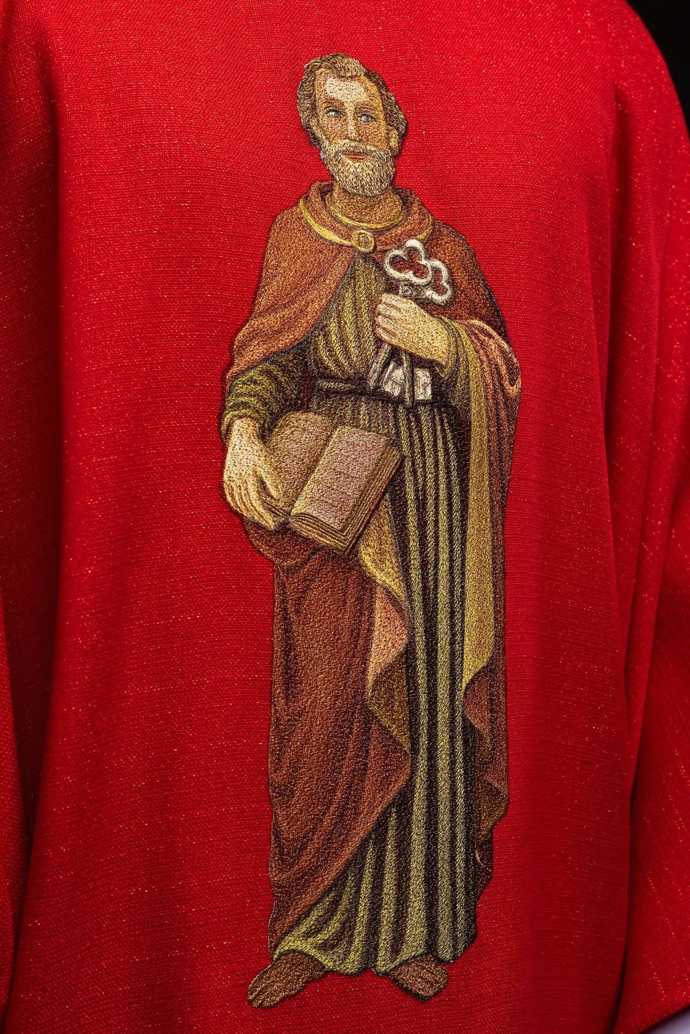 Richly embroidered chasuble with the image of Saint Peter red