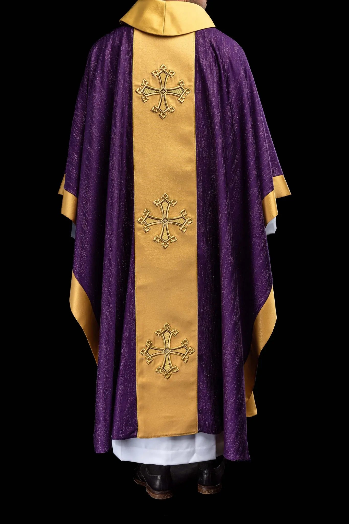 Purple chasuble with a vertical gold band featuring embroidered stylized crosses, gold trim on sleeves and collar, and a stand-up collar.