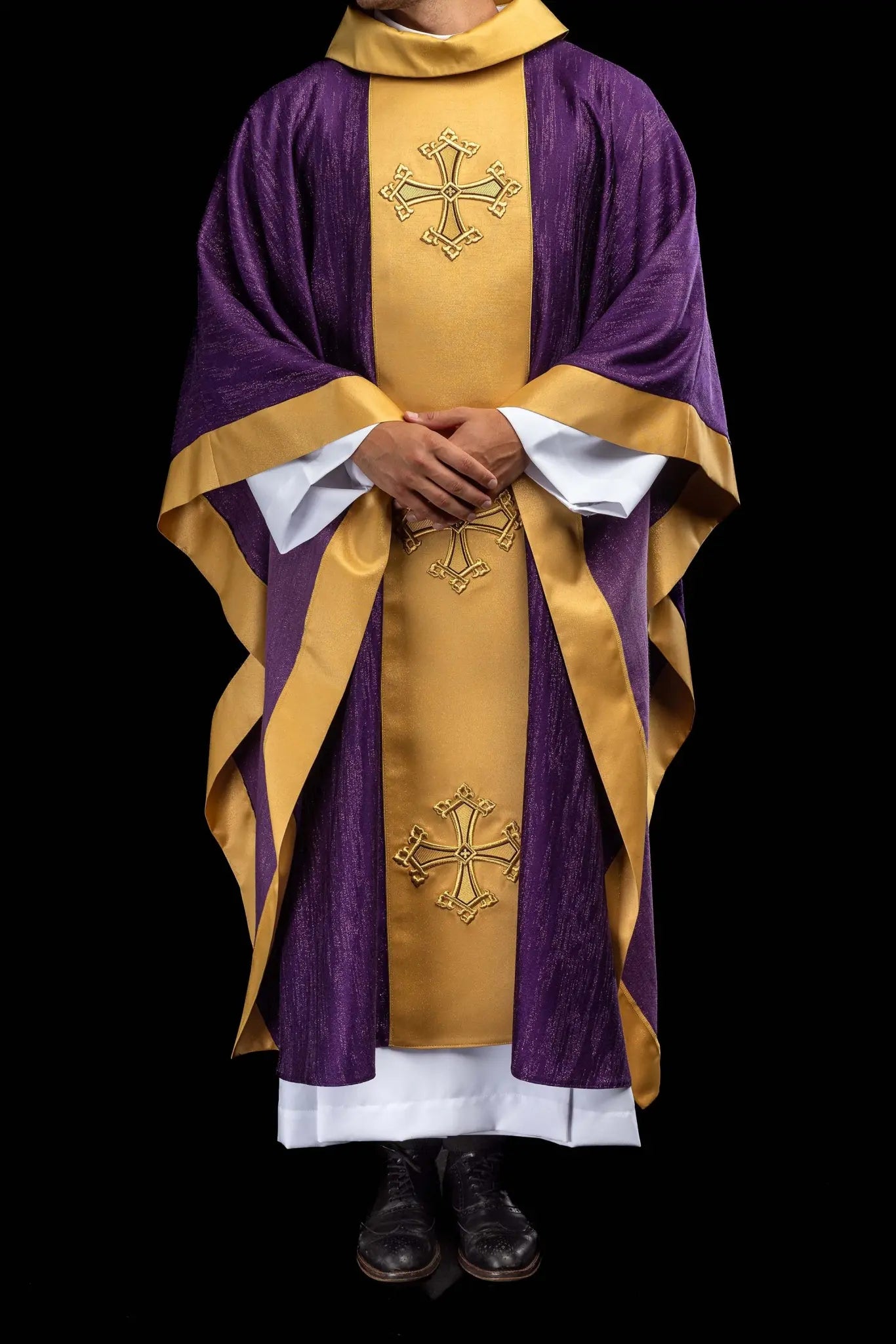 Purple chasuble with a vertical gold band featuring embroidered stylized crosses, gold trim on sleeves and collar, and a stand-up collar.