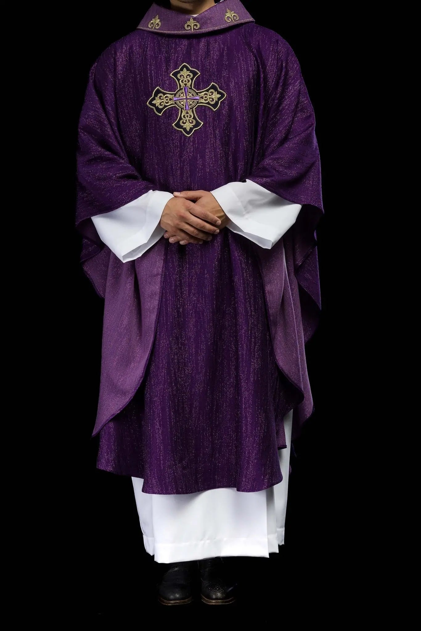 Purple chasuble with embroidered cross motif on de