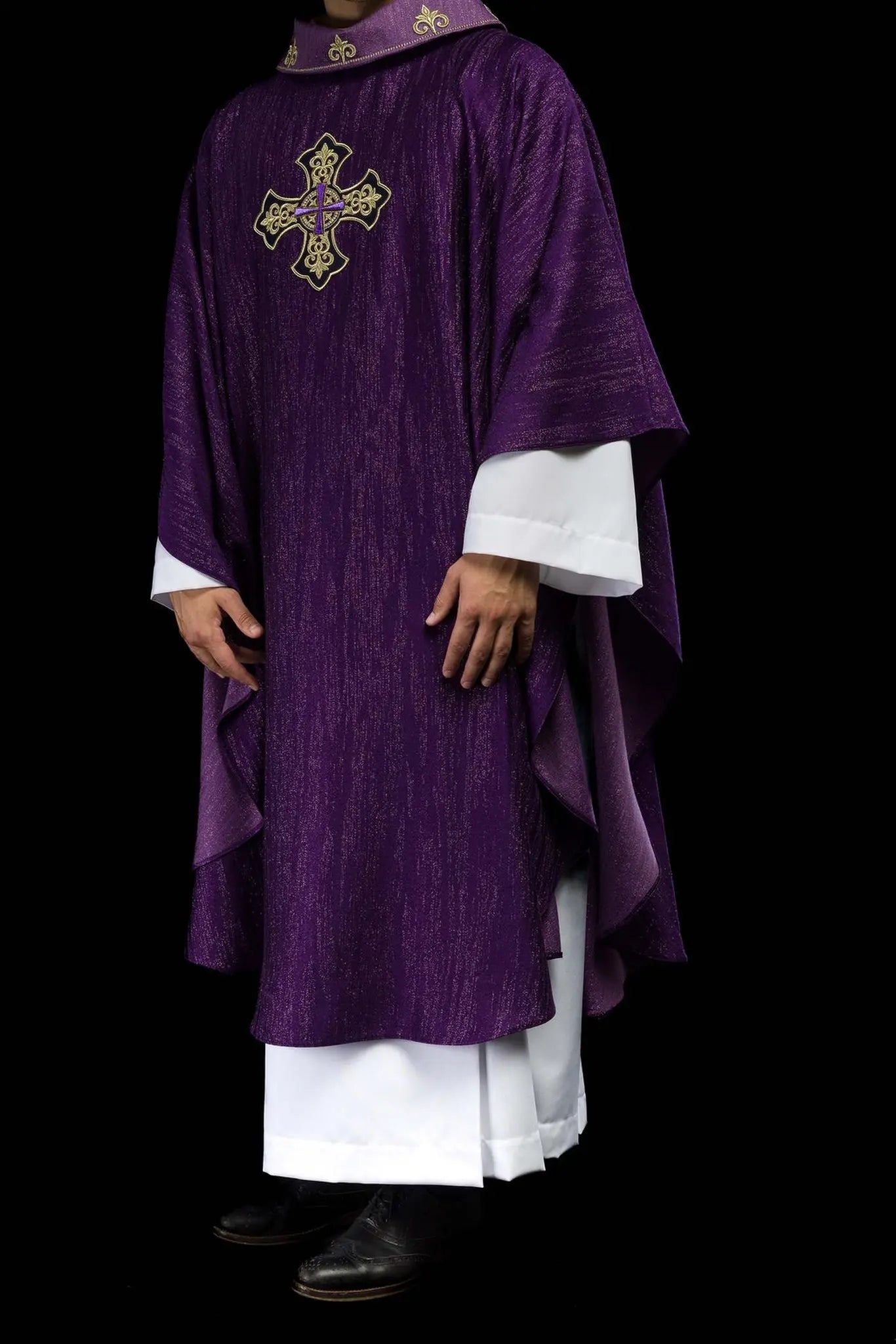 Purple chasuble with embroidered cross motif on de