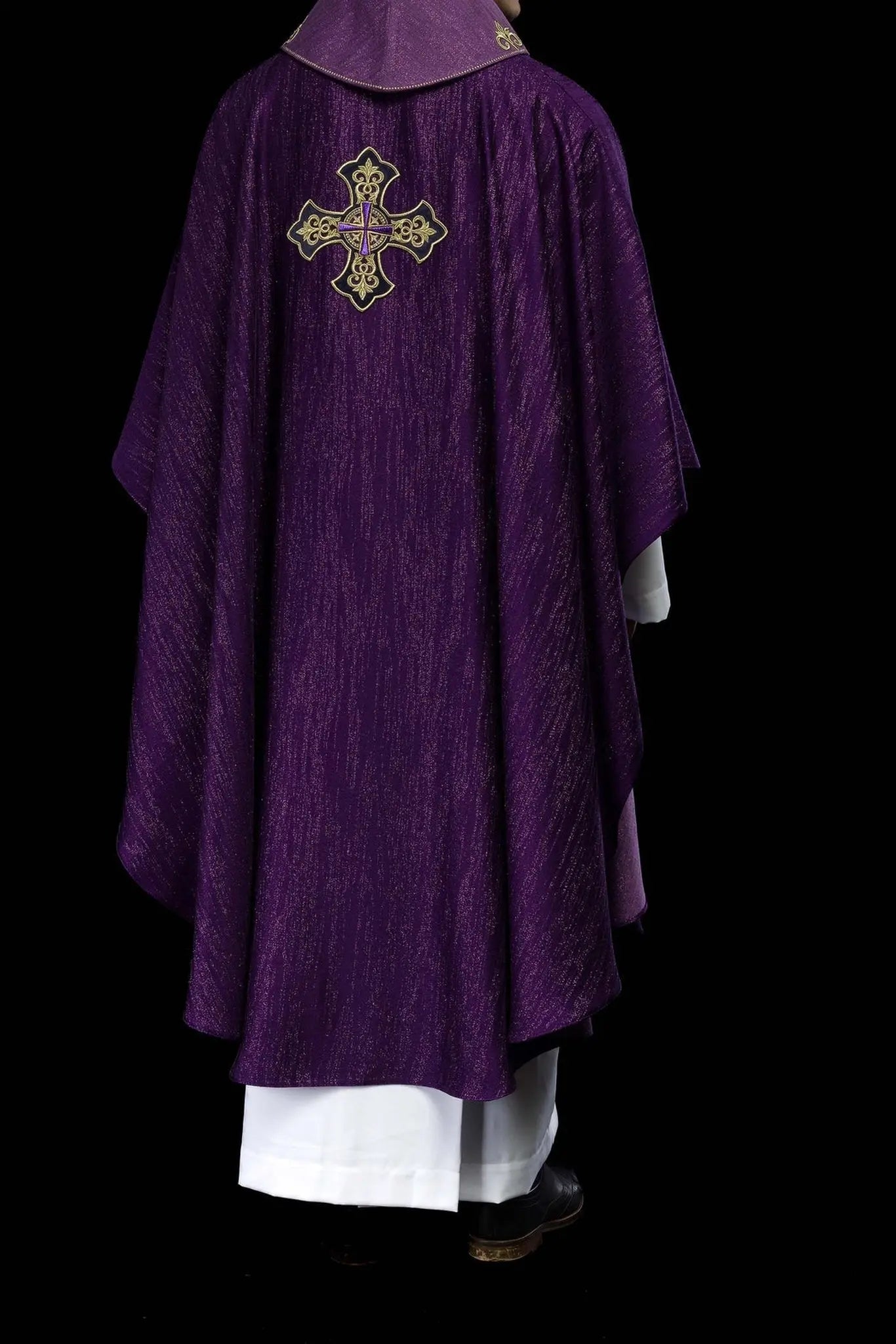 Purple chasuble with embroidered cross motif on de