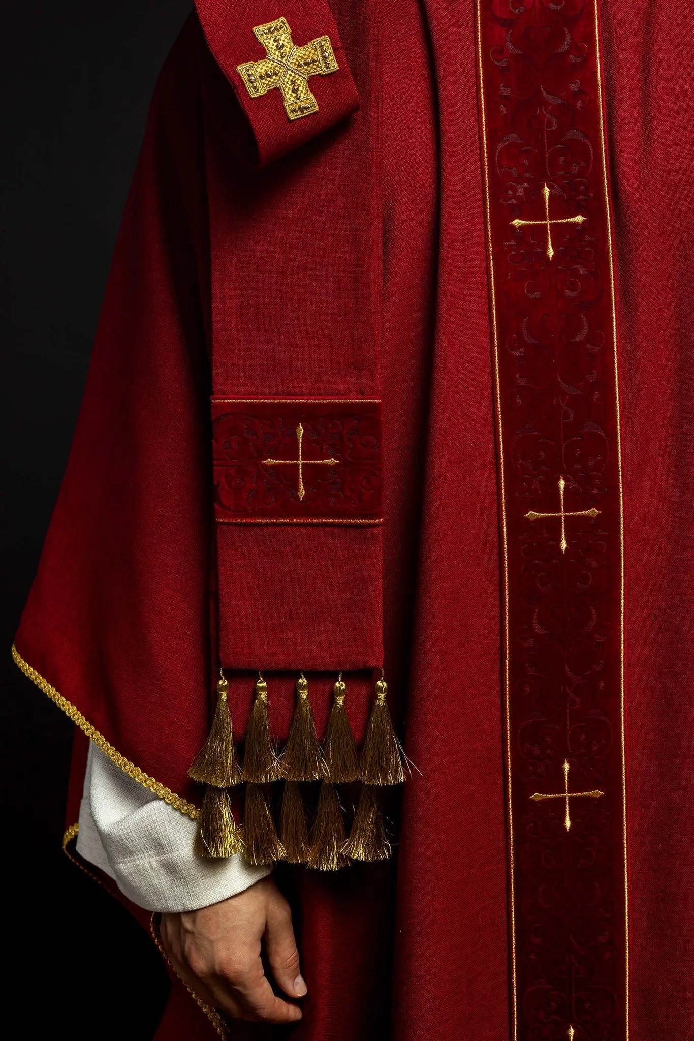 Red chasuble with an embroidered band of crosses