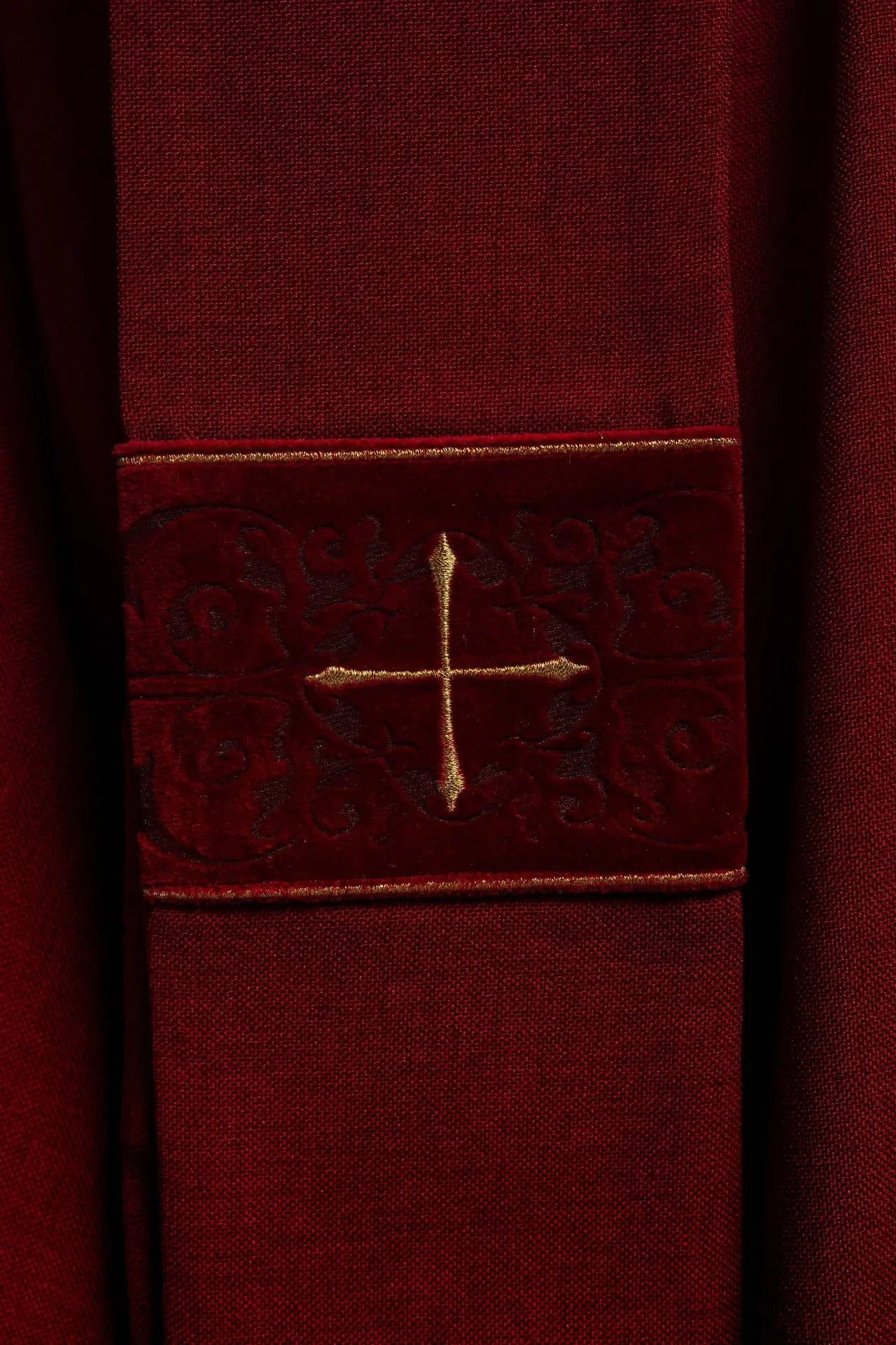 Red chasuble with an embroidered band of crosses