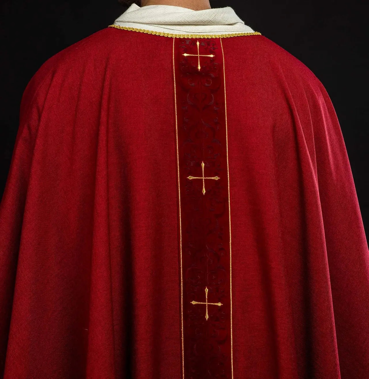 Red chasuble with an embroidered band of crosses