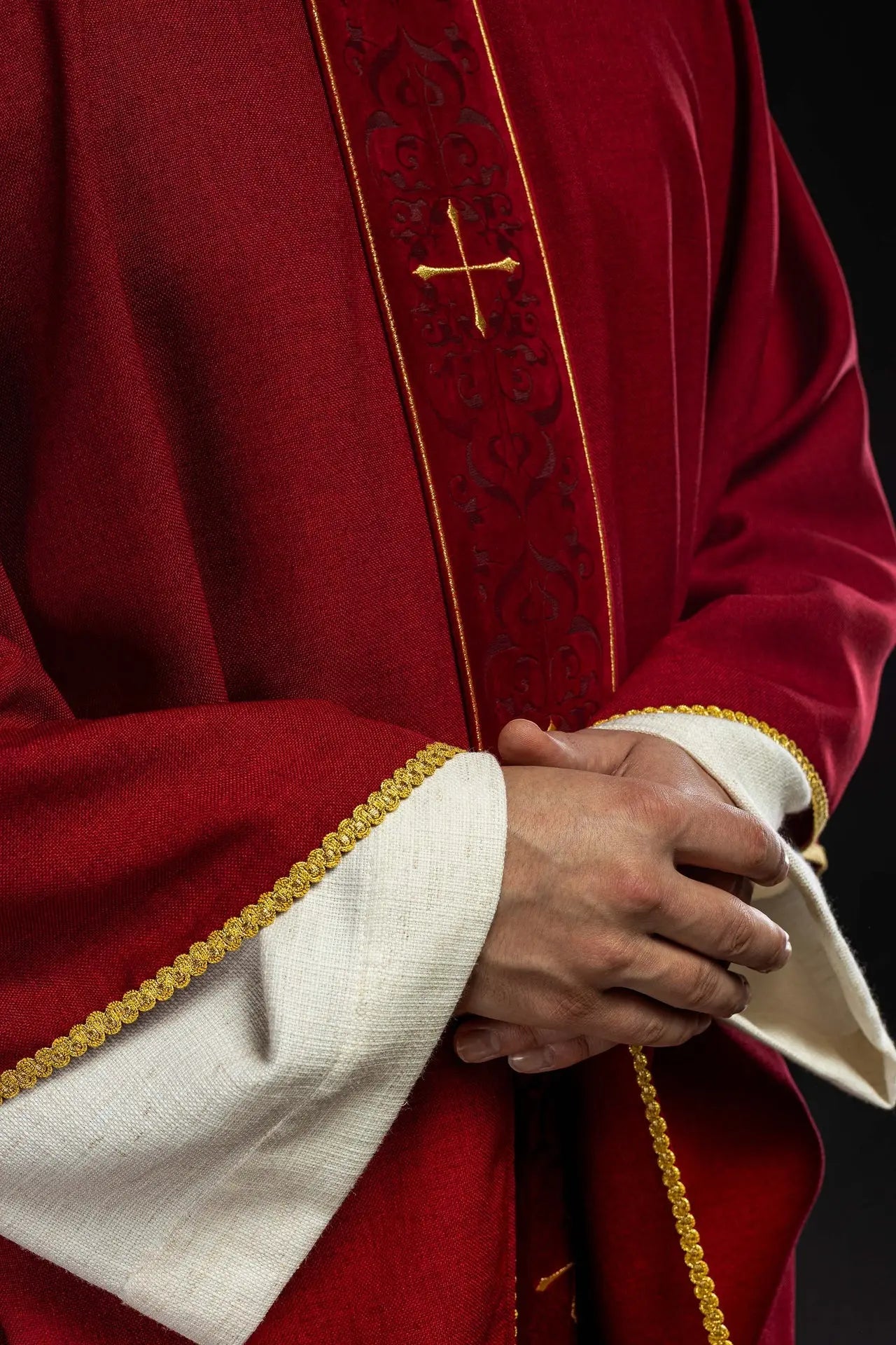 Red chasuble with an embroidered band of crosses