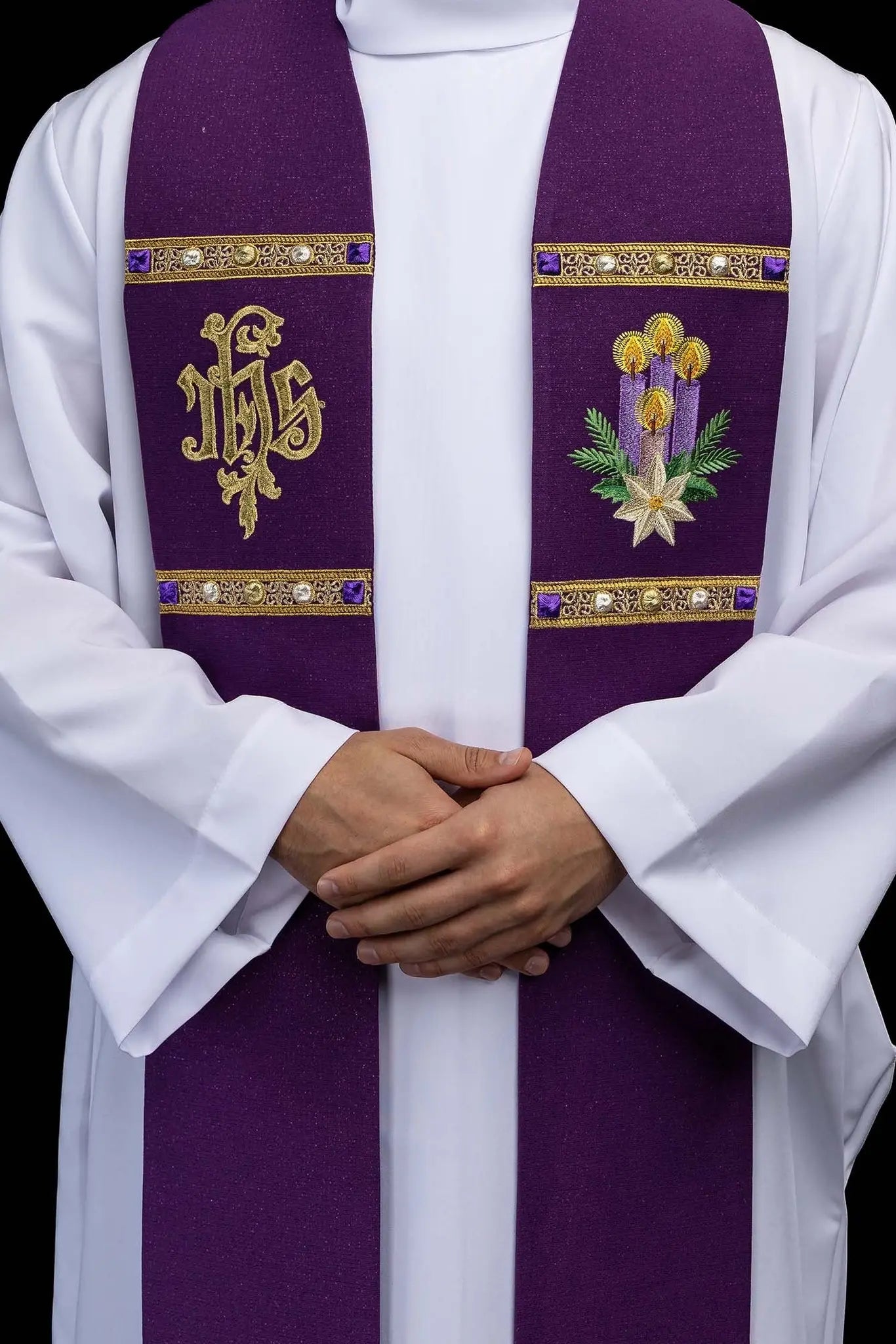 Purple Advent stole with gold IHS embroidery and Advent candle motif, made from shimmering fabric.