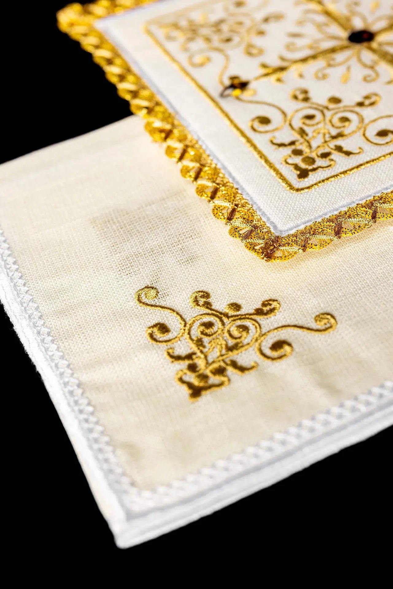Richly decorated linen cup set with cross embroidery