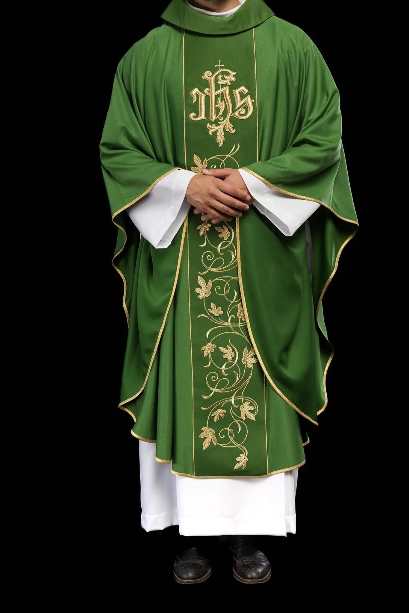 Green liturgical chasuble with richly decorated belt with floral motif and IHS