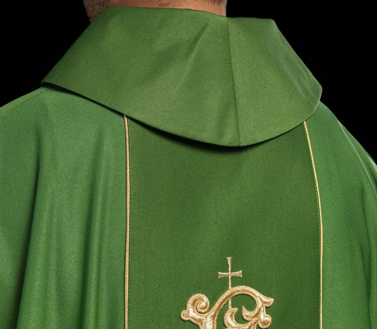 Green liturgical chasuble with richly decorated belt with floral motif and IHS