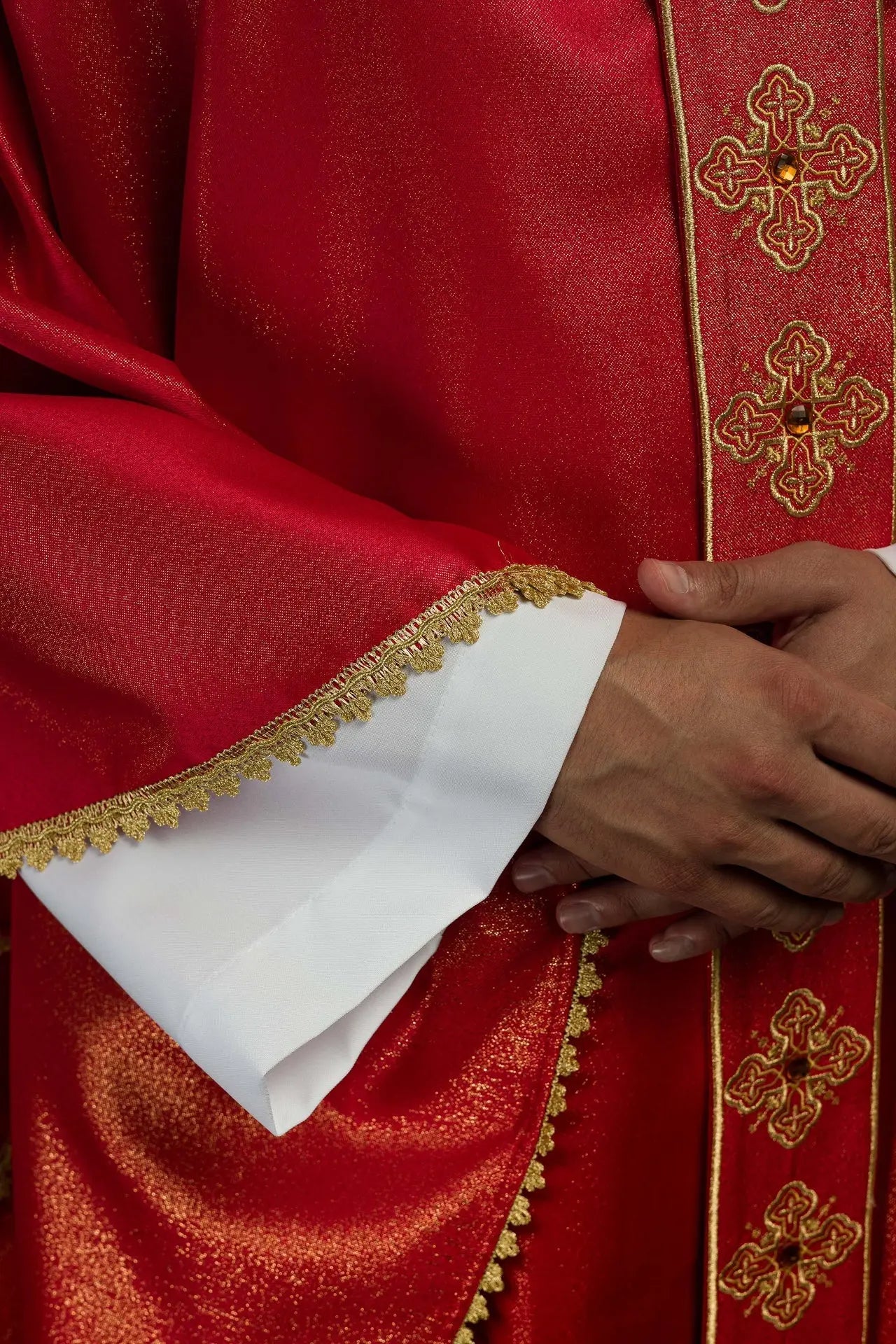 Chasuble in red with embroidered belt and collar decorated with stones