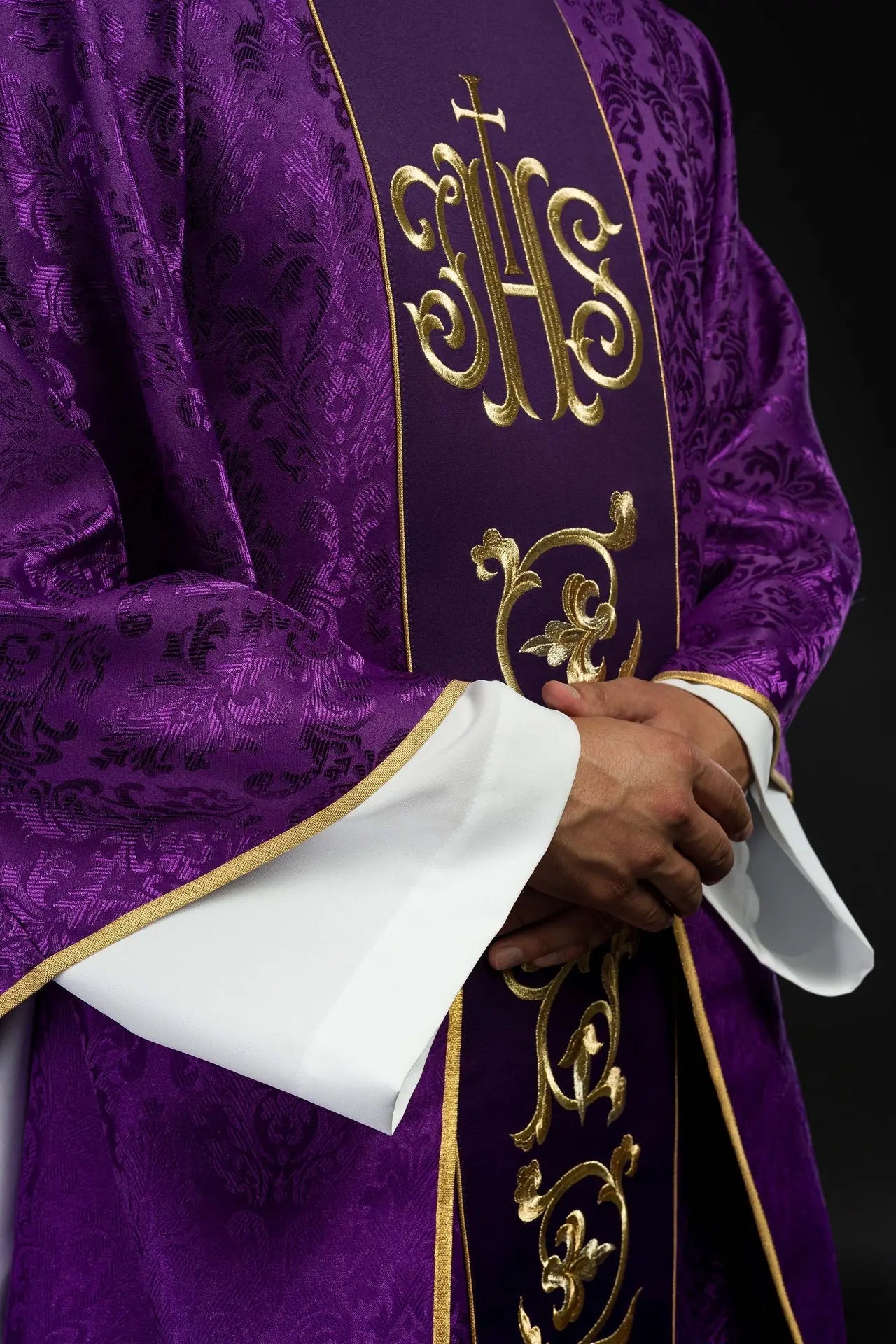Purple liturgical chasuble with richly decorated IHS belt