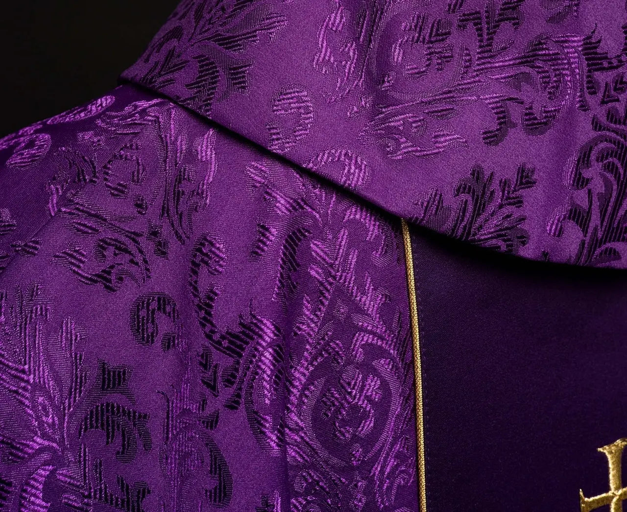 Purple liturgical chasuble with richly decorated IHS belt