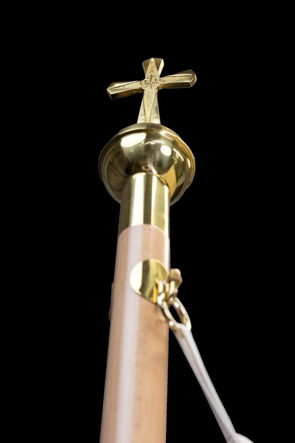 White baldachin with cross-topped pole attachment, close-up view