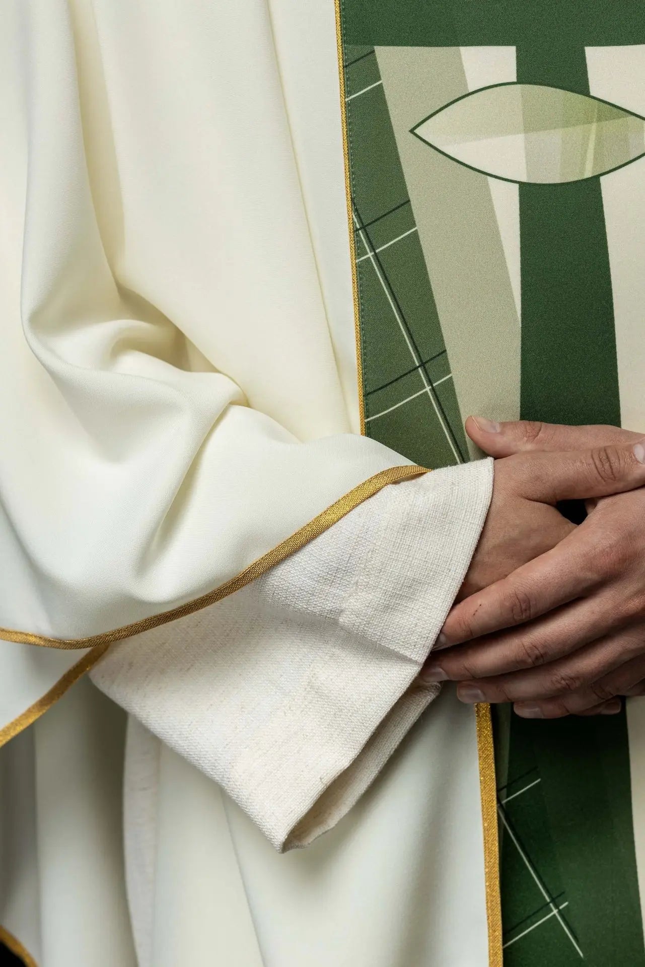 White chasuble embroidered with cross and fish pattern