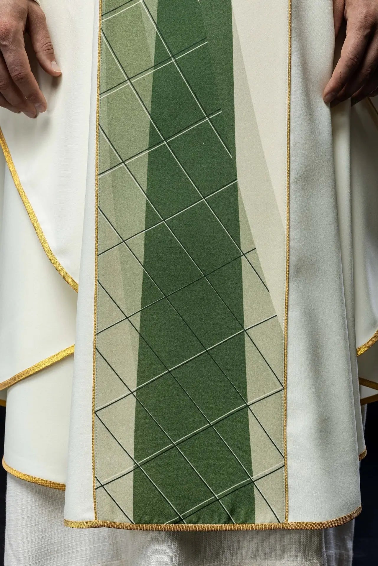 White chasuble embroidered with cross and fish pattern