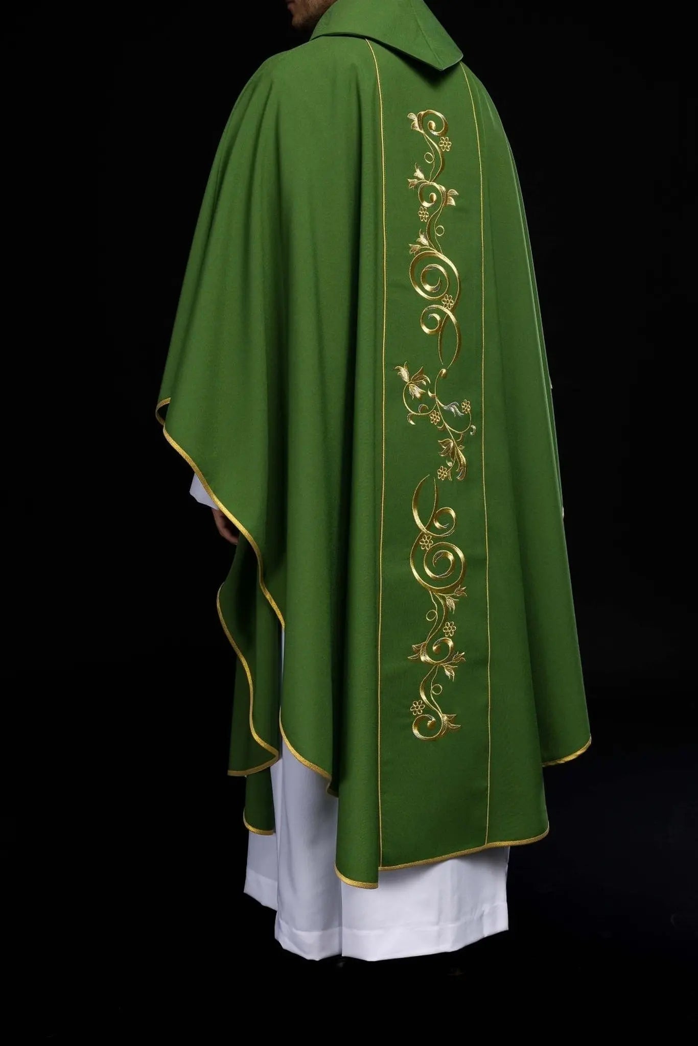 Richly decorated green chasuble with gold motif and wide IHS band