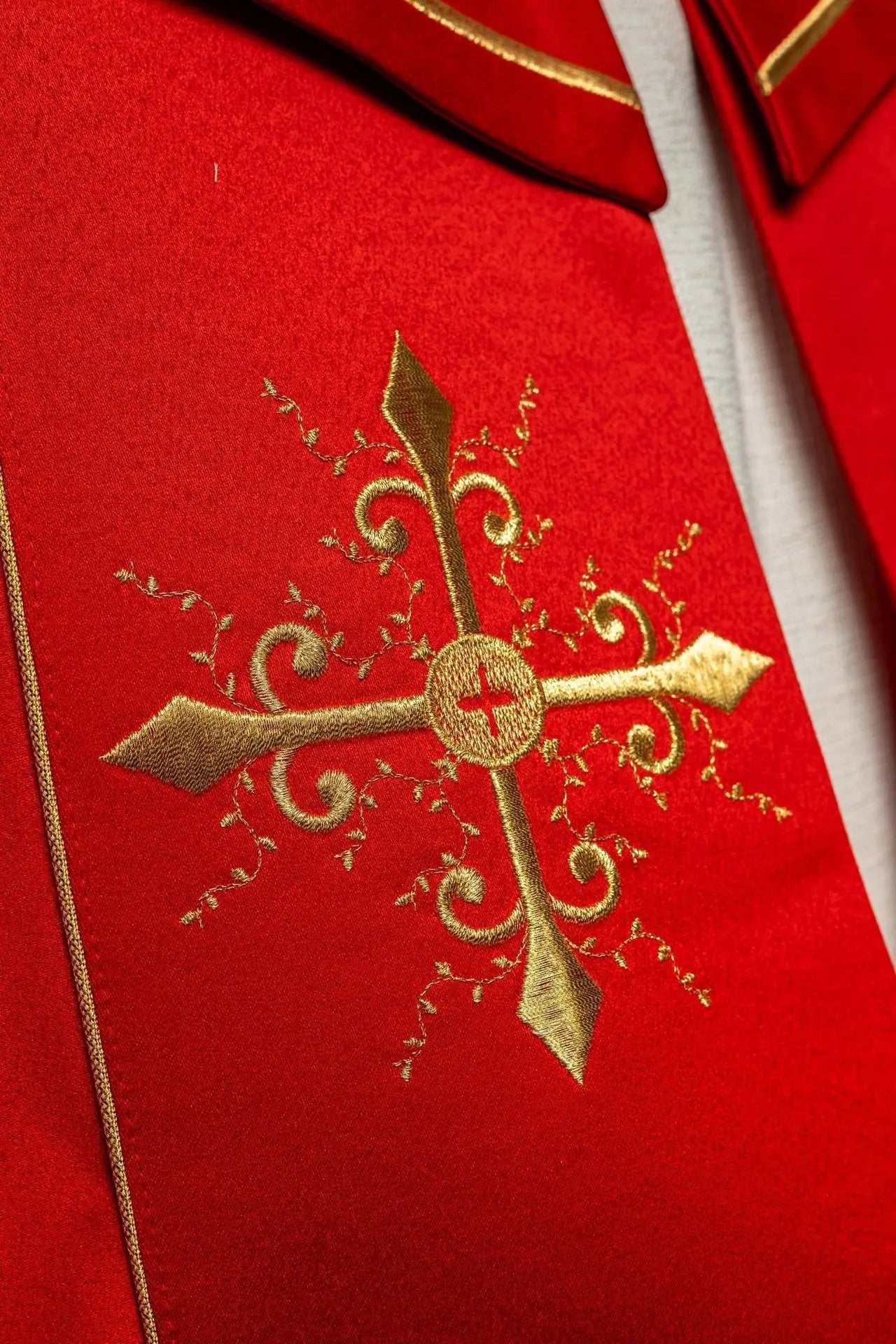 Red liturgical cope with gold crosses embroidery
