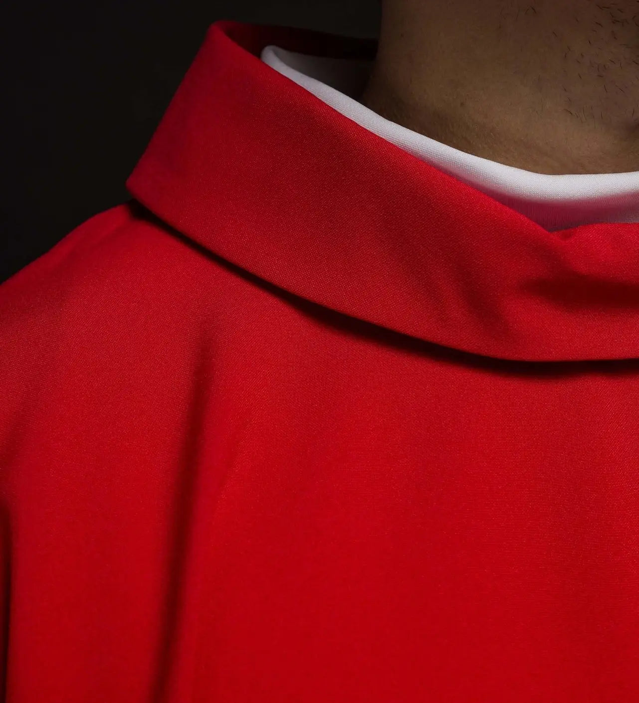 Red chasuble embroidered with cross motif