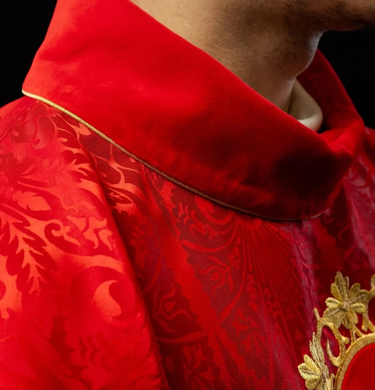 Red chasuble embroidered with the pattern of Jesus Christ