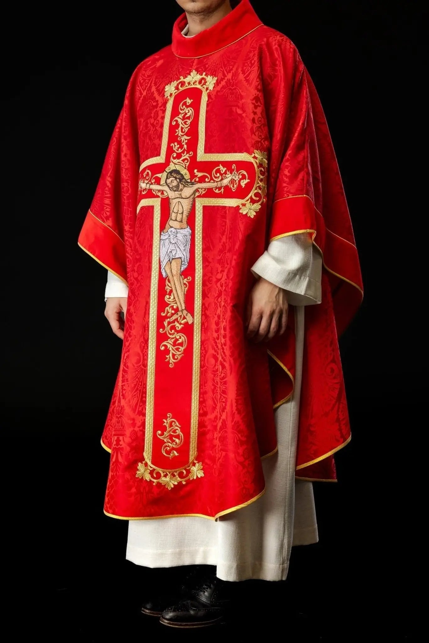 Red chasuble embroidered with the pattern of Jesus Christ
