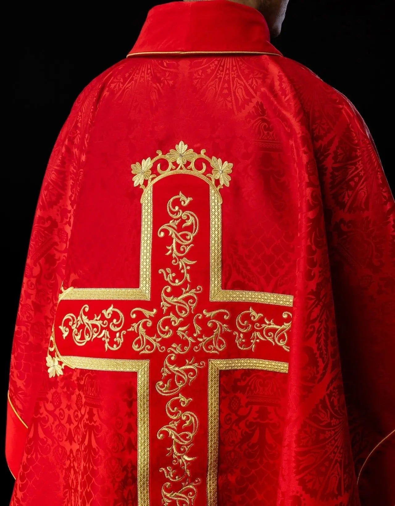 Red chasuble embroidered with the pattern of Jesus Christ