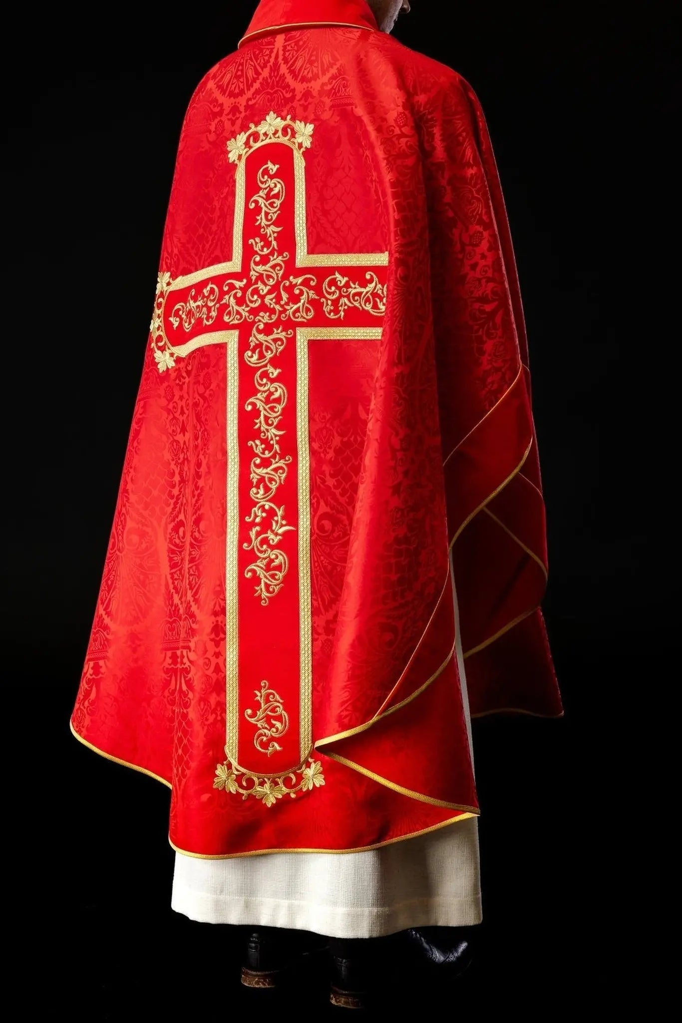 Red chasuble embroidered with the pattern of Jesus Christ