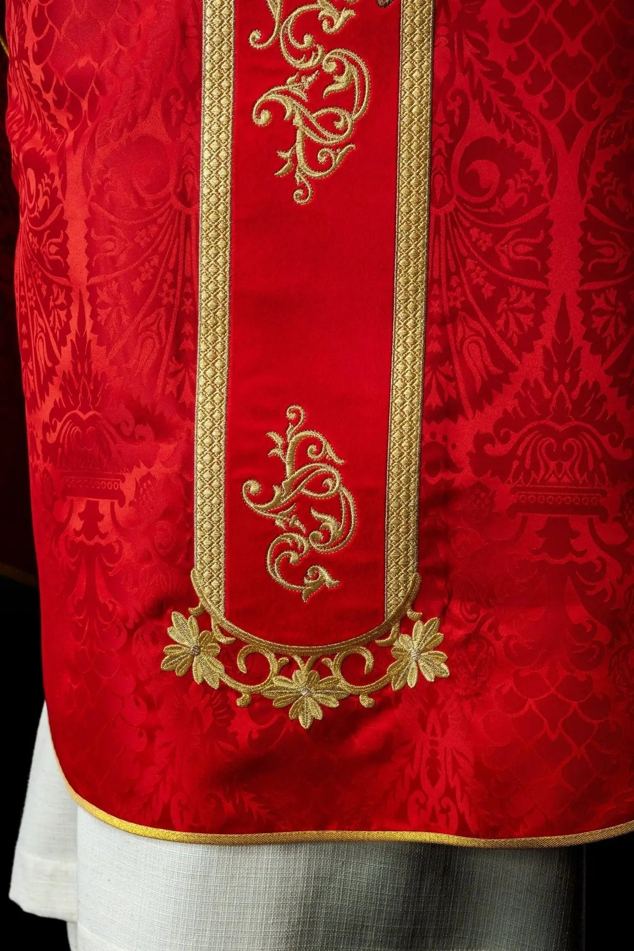 Red chasuble embroidered with the pattern of Jesus Christ