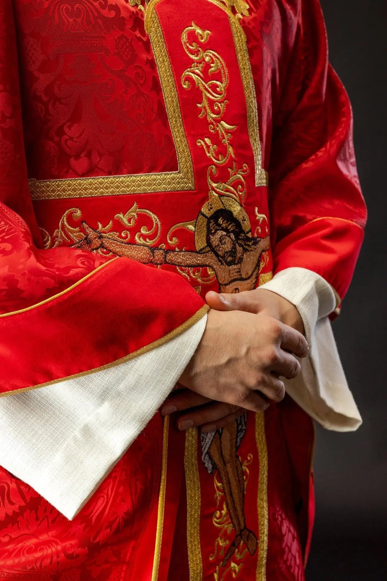 Red chasuble embroidered with the pattern of Jesus Christ